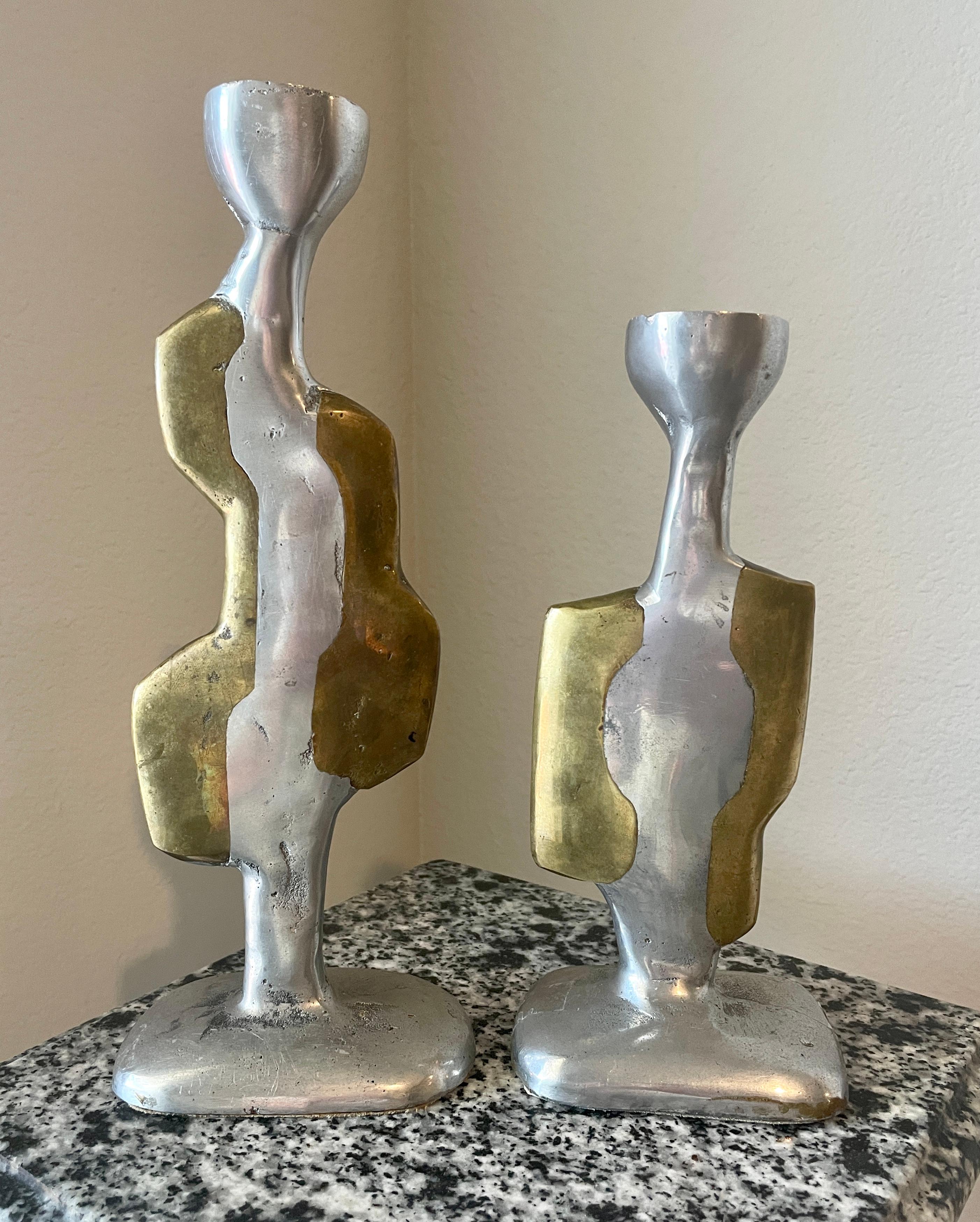 David Marshall Abstract Brutalist candle sticks- A pair. These have a nice patina on then consistent with age 
Taller Candlestick: 10.75 H x 4 W x 2.75 D
Shorter Candlestick: 8H x 4 W x 3D.