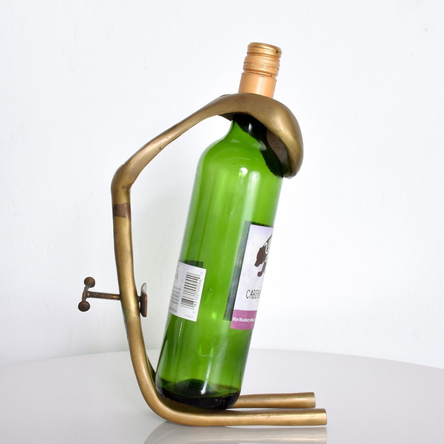  Sculpturally unique wine holder by Spanish designer, David Marshall
Created in bronze. Made in Spain. This piece is signed, circa 1980s.
Dimensions are: 10 3/4