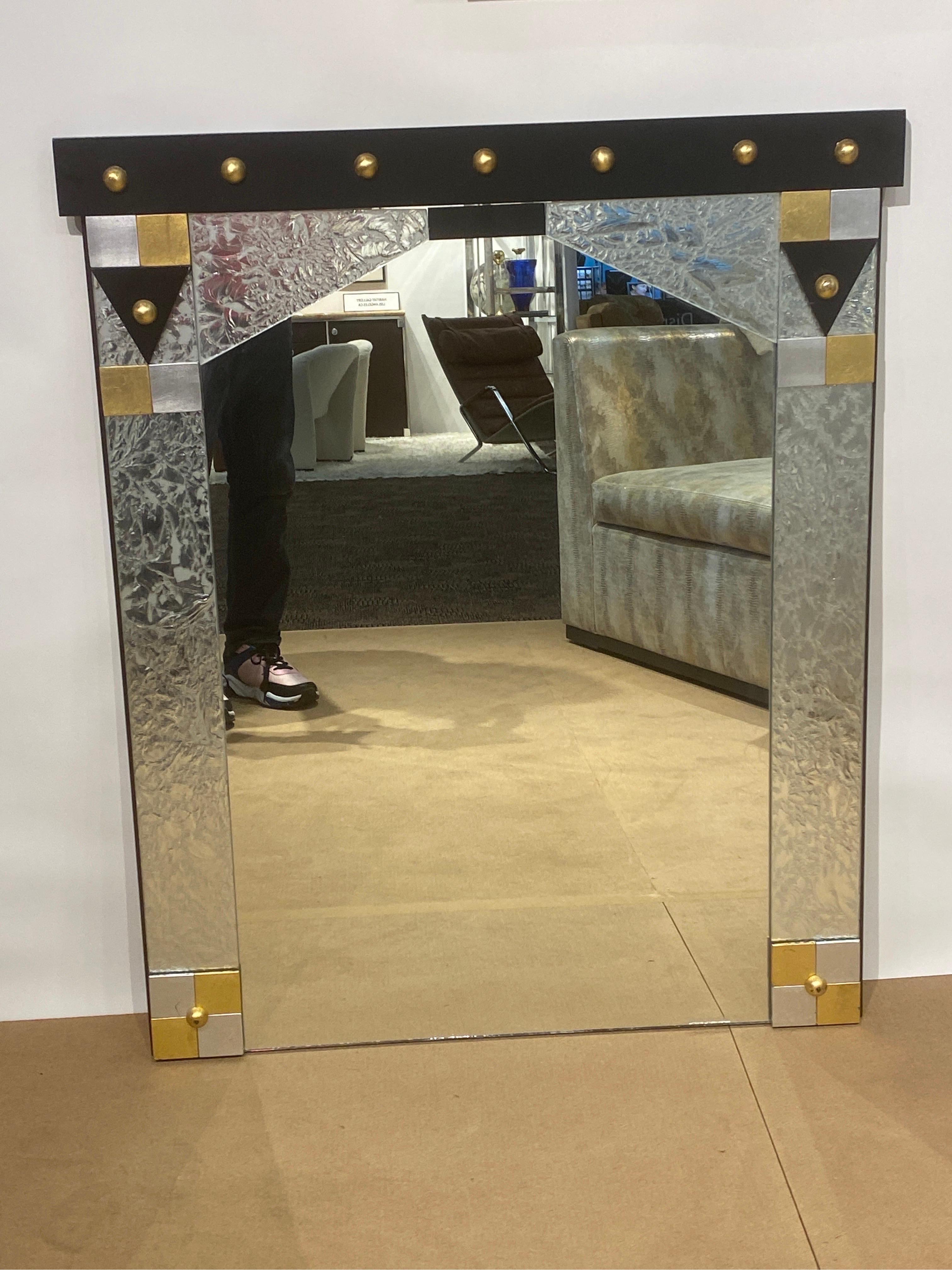 Perfect for a powder room, hallway or bedroom, this is a rare signed piece by David Russell. His mirrors made in the 1980s were very high end and are now extremely and sought after. 
This is the best example if his work I have seen. Post modern in