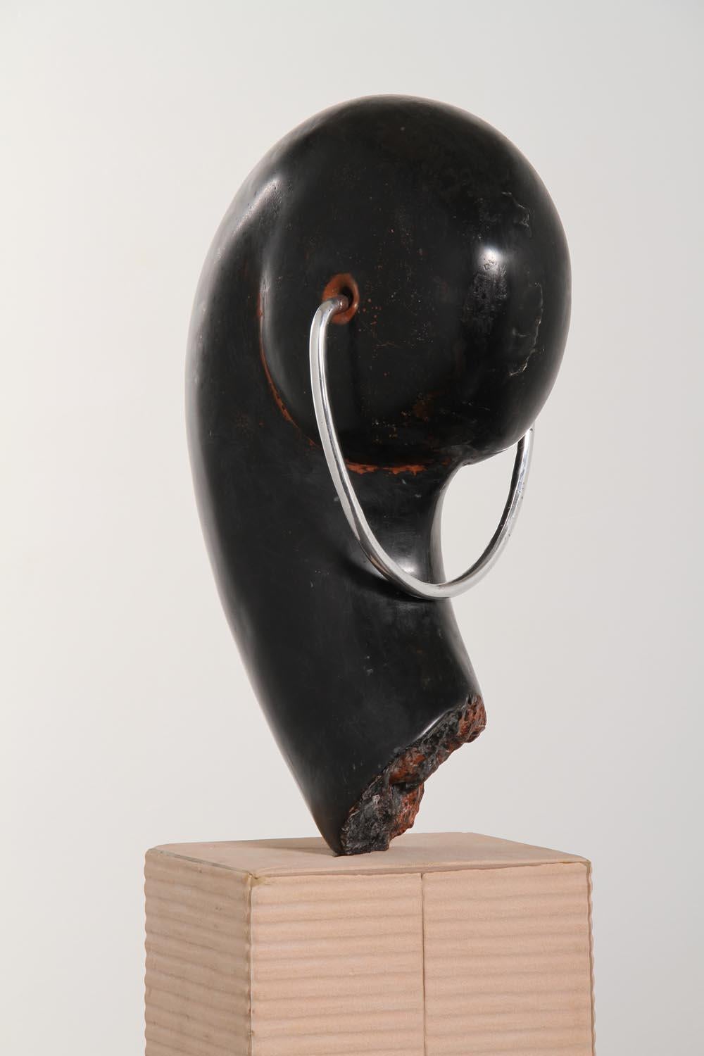 KING OF THINGS -This is a delightful, happy, and playful piece. Henry Moore, Naguchi, Brancusi, and other sculptors over centuries have had a tendency to stack things.  This piece has a major air space under the piece in order to capture the treads