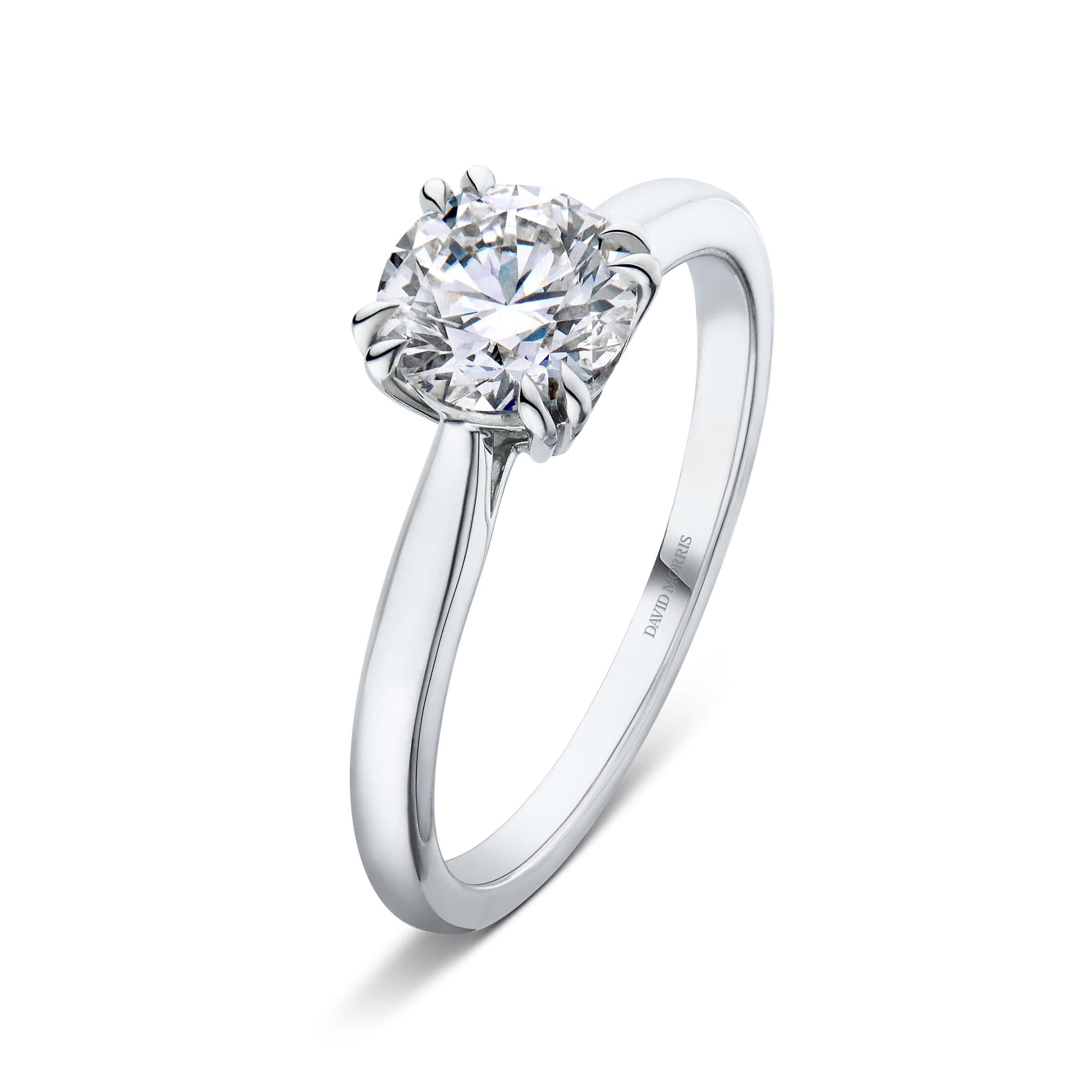 This classic 18-carat white gold solitaire ring features a mesmerizing 1.01-carat round brilliant white diamond at it's centre. Set in lustrous 18-carat white gold, the metal beautifully enhances the diamond's radiance, creating a harmonious blend