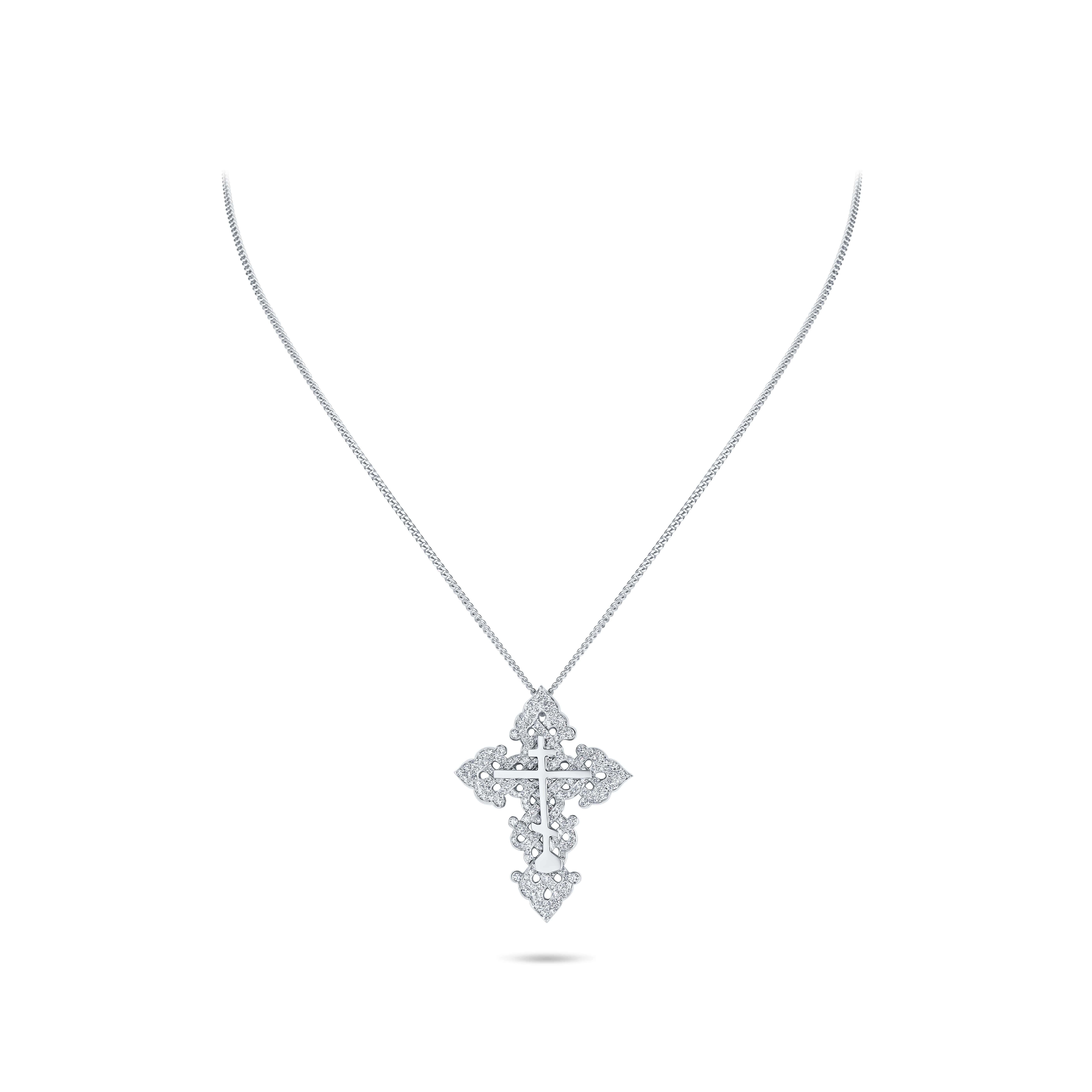 Experience the opulence of the David Morris-designed Diamond Ornate Cross Pendant, meticulously crafted in 18-carat white gold. A testament to refined elegance, this pendant necklace showcases an intricately designed cross, adorned with diamonds