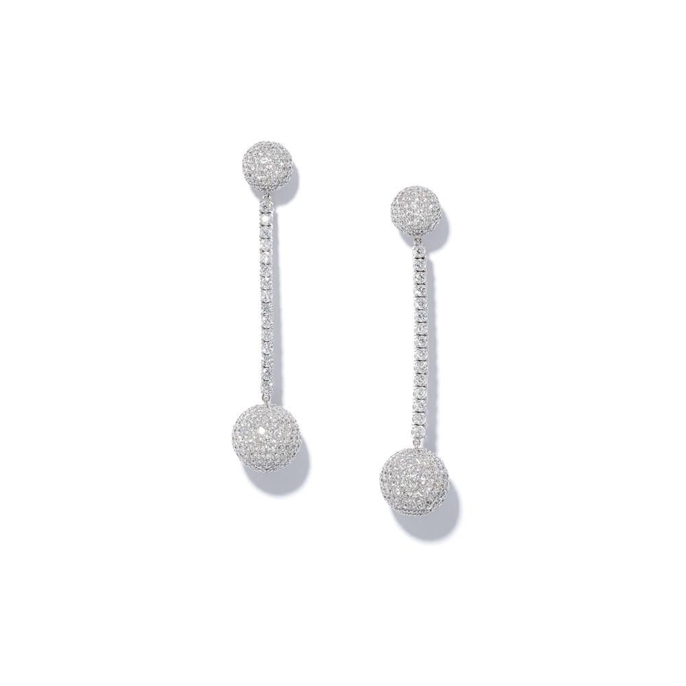 These white diamond earrings from David Morris have a sculptural quality that strikes the perfect balance between timeless and contemporary. 
The earrings’ fitting and drop are each composed of a glistening, diamond-embellished sphere, linked by a