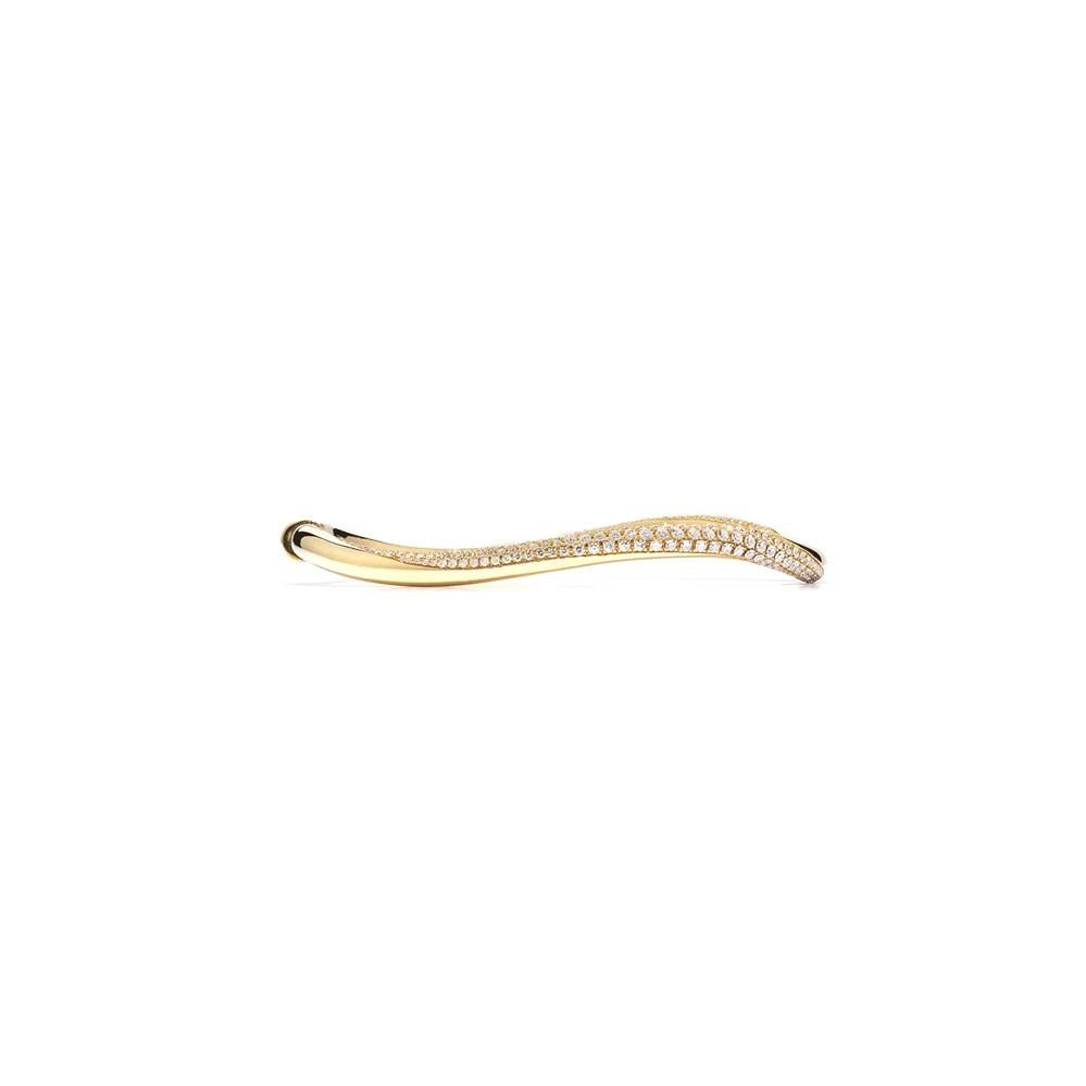 London jeweller David Morris is known for its classics with a twist, and this gold and white diamond bangle gives a timeless jewellery staple exactly that. This yellow gold bangle has an unusual, slightly twisted composition that creates a wave-like
