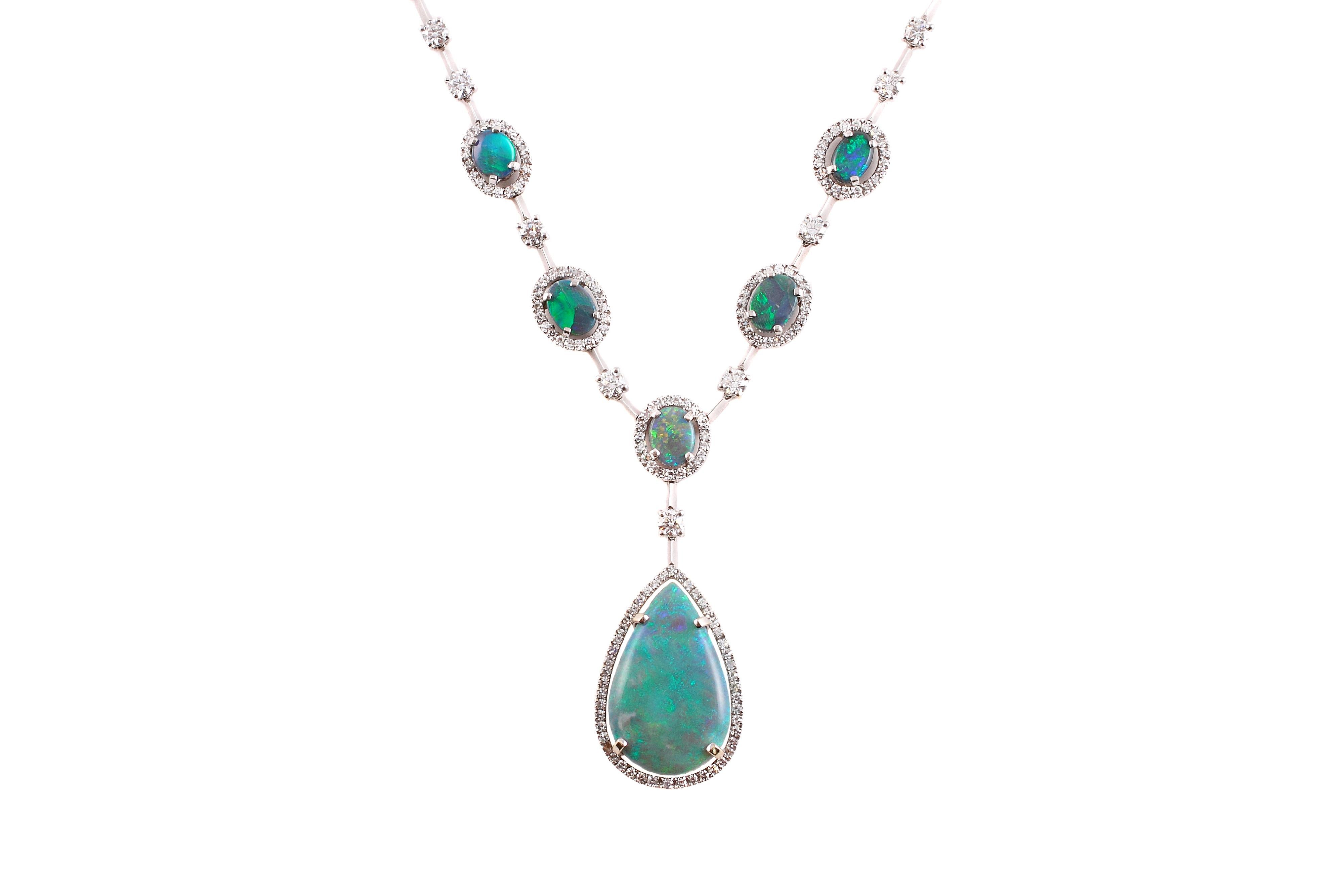 This breathtaking necklace is in 18 karat white gold, measures approximately 17 inches and the stunning opal drop measures approximately 1 1/2