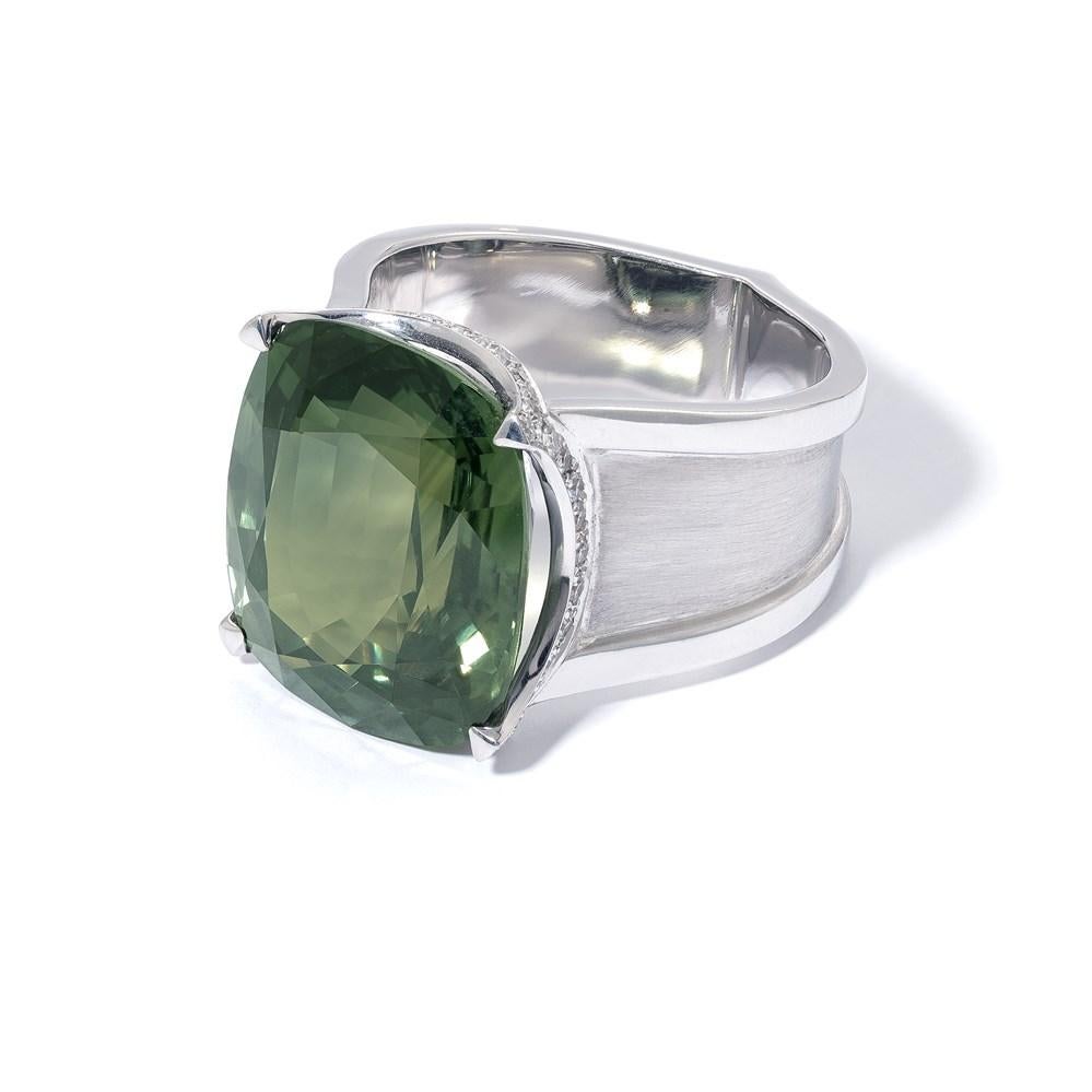 This green sapphire ring from David Morris is a beautiful example of the many, captivating colours of sapphires. The ring’s 22 carat, cushion-cut green sapphire has deep, moss-green colour; its striking size and beautiful hue complemented by a white