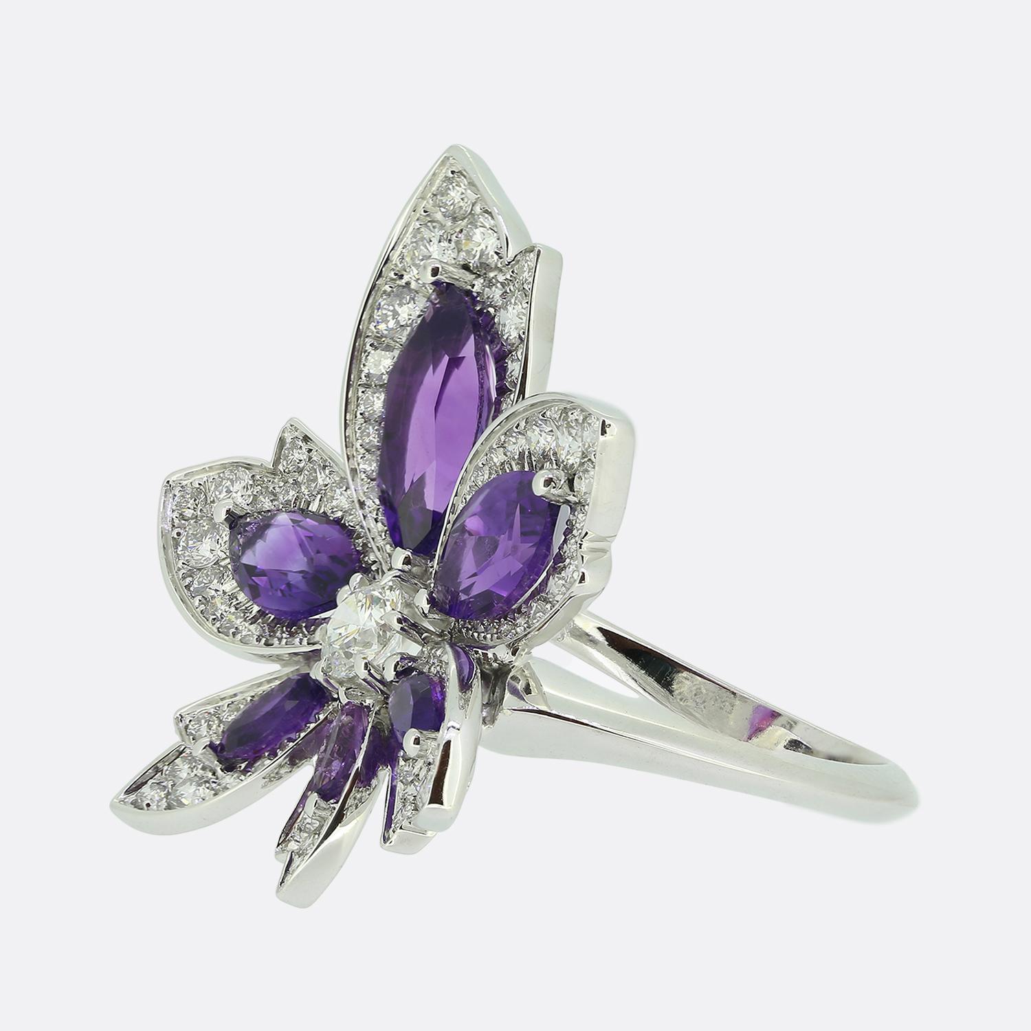Here we have a stunning ring from London based jewellery designer, David Morris. This 18ct white gold piece has been crafted into the shape of a leaf similar to that of a sycamore or maple tree. The centre of the face has been set with a single