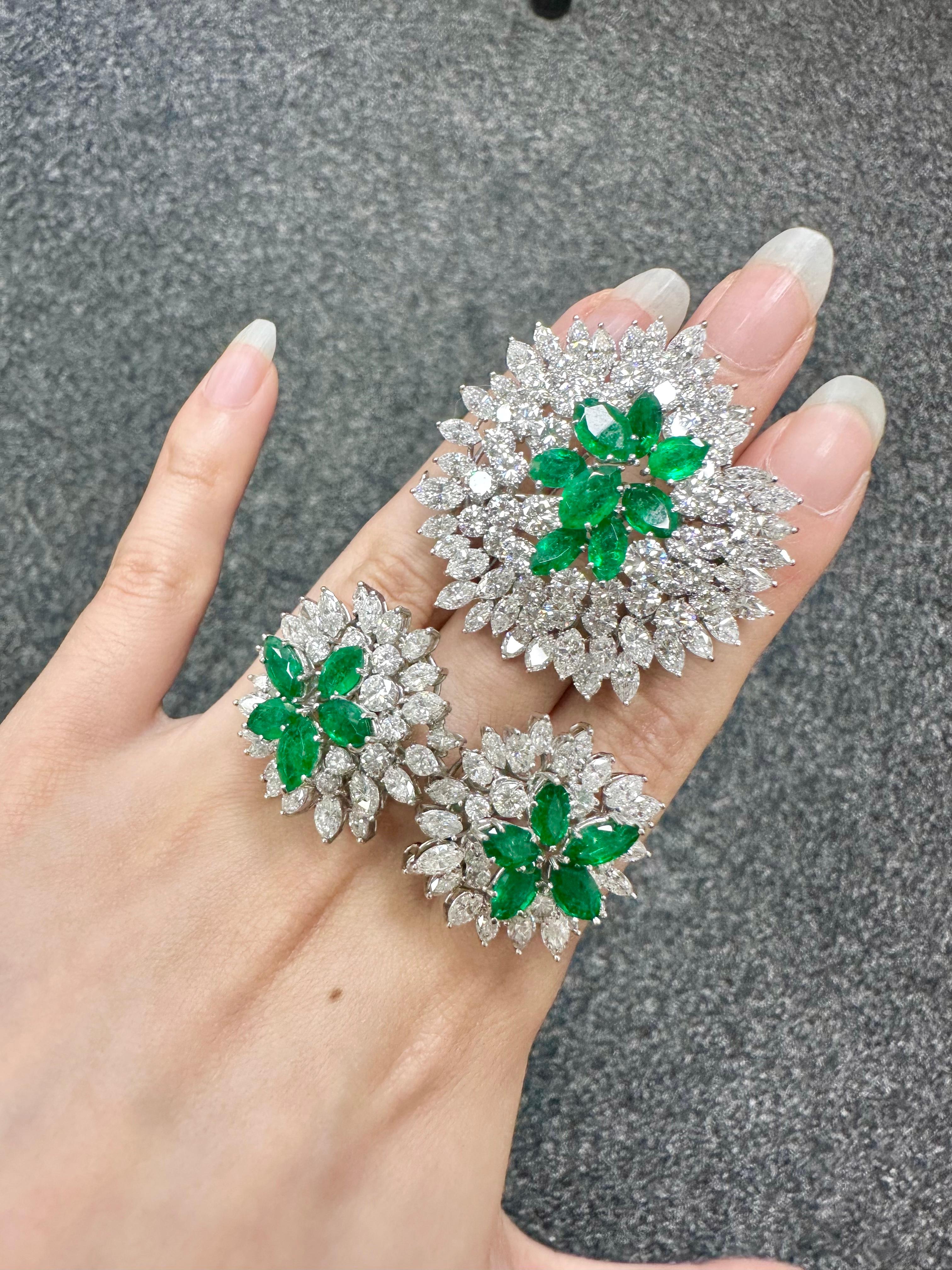This magnificent emerald diamond brooch and earrings set from the London jeweller David Morris are presented with original packaging and paperwork. Vibrant marquise emeralds and natural white diamonds make for a thrilling combination in this