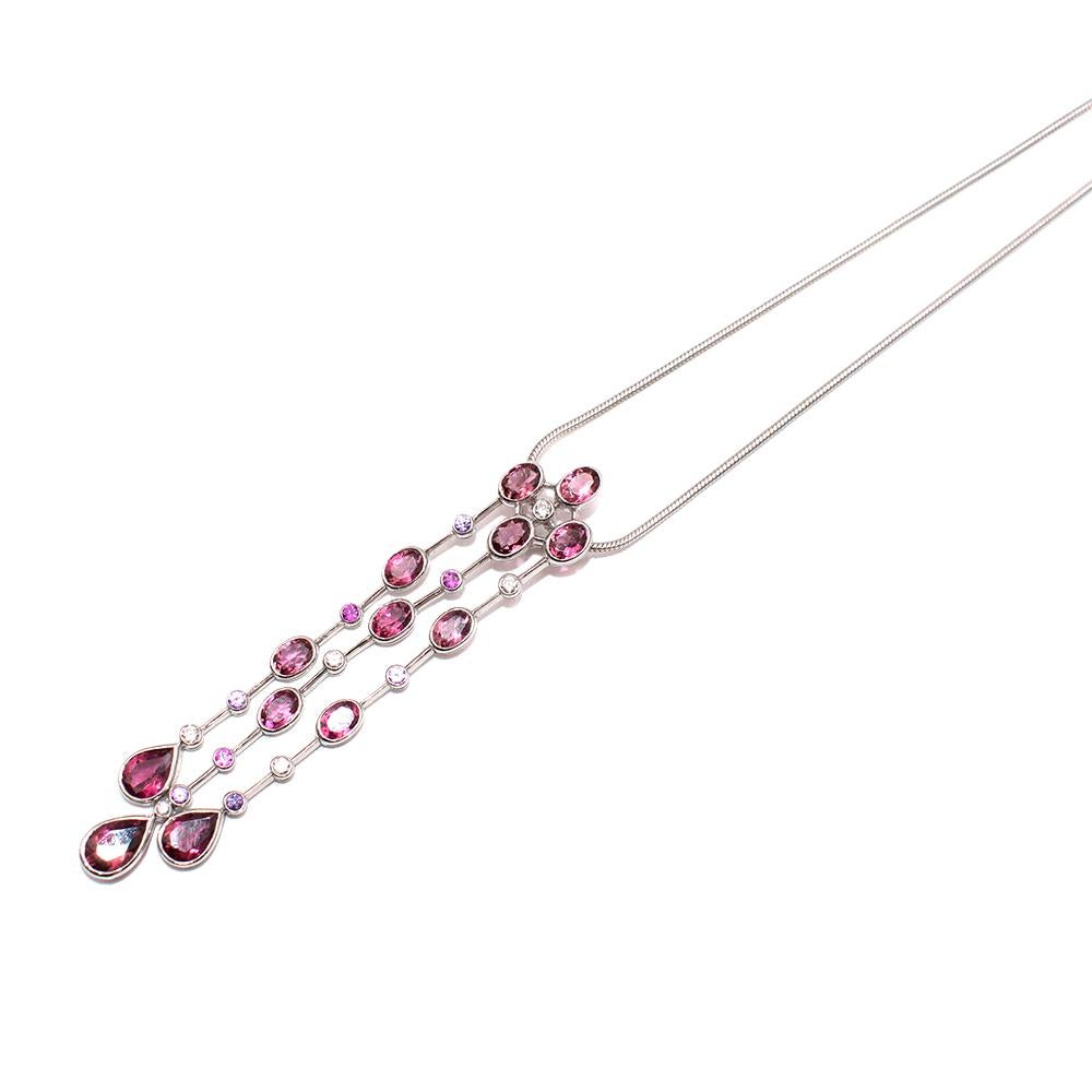 David Morris Pink Sapphires & Diamonds Platinum Pendant Necklace 

-Luxurious articulated pendant featuring 10 oval cut,  8 small round cut and 3 tear drop cut pink sapphires. The pink gems are paired with 6 small round cut light reflective white