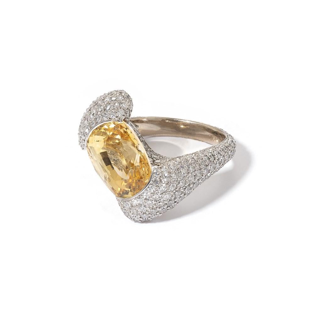 This spectacular yellow sapphire and white diamond ring from David Morris is reminiscent of an over-sized, bejewelled bow, taking its design inspiration from the signature silhouettes of the 1960s, when the House was founded in London. The beautiful