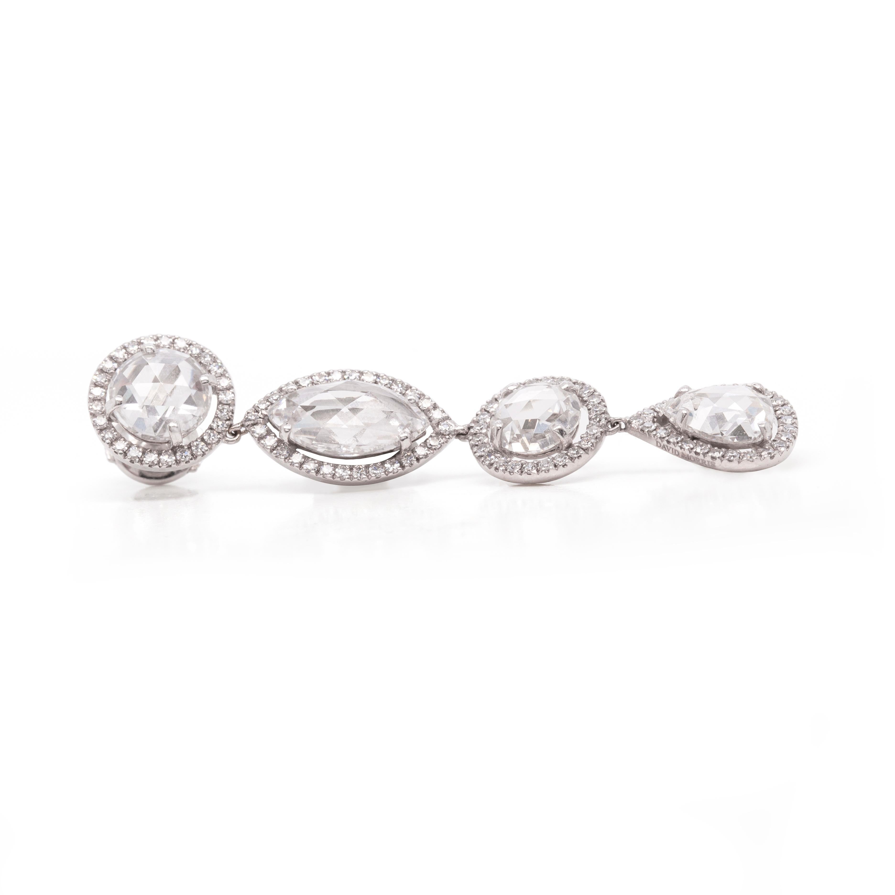 These stunning diamond David Morris earrings are a real showstopper. Four round rose cut, two marquis rose cut and two pear shape rose cut diamonds, all set in diamond halos,  total approximately 10 carats across the pair. These breathtaking