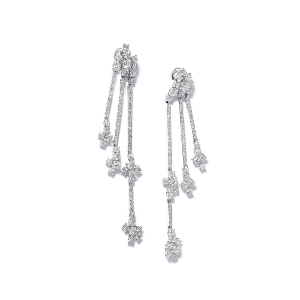From London jeweller David Morris, this clean-lined and minimalist twist on diamond tassel earrings are a versatile design you’ll wear day, night and on repeat.

These elegant earrings each have three strands of white diamonds, with linear micro-set