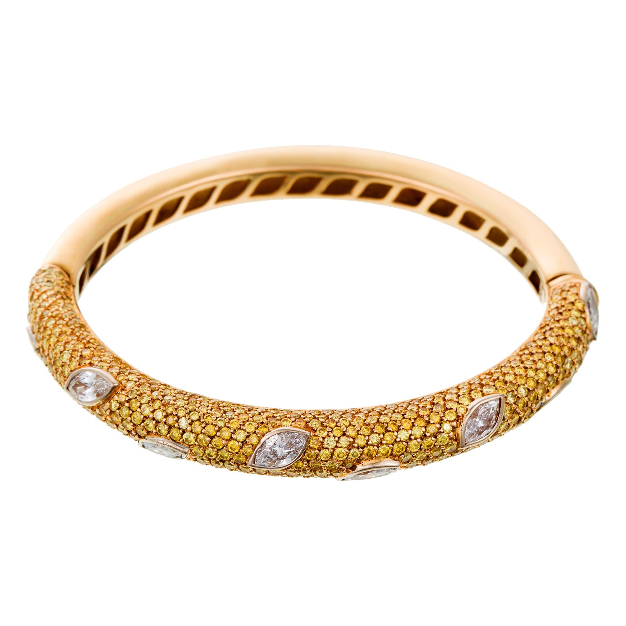 Inject your jewellery look with some signature David Morris colour with this beautiful yellow diamond and white diamond bangle from the renowned London jewellery house.

This one-of-a-kind split bangle is crafted in yellow gold, half of which is set