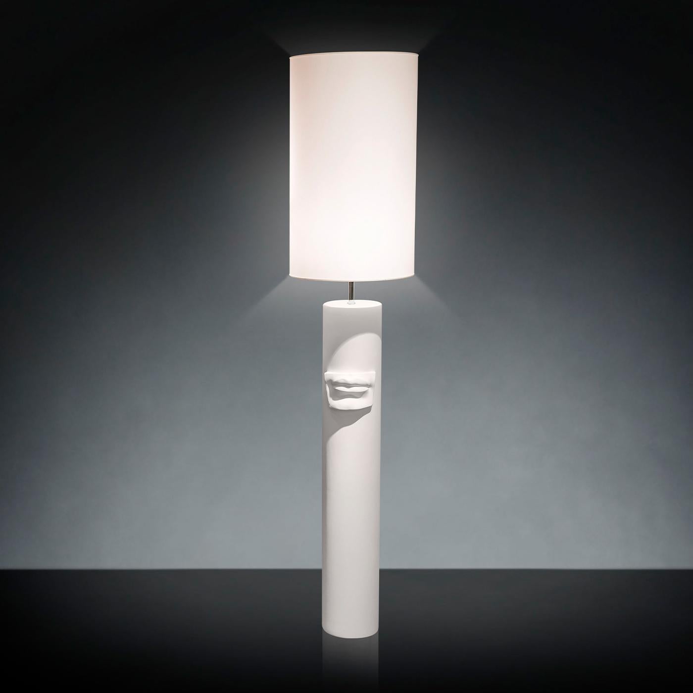 Fashioned entirely of white ceramic, this floor/table lamp pays tribute to Michelangelo's David, whose mouth appears in low relief on the sensuously sculptured cylindrical base. The lampshade softens the illumination provided by an E27 max 50W bulb,