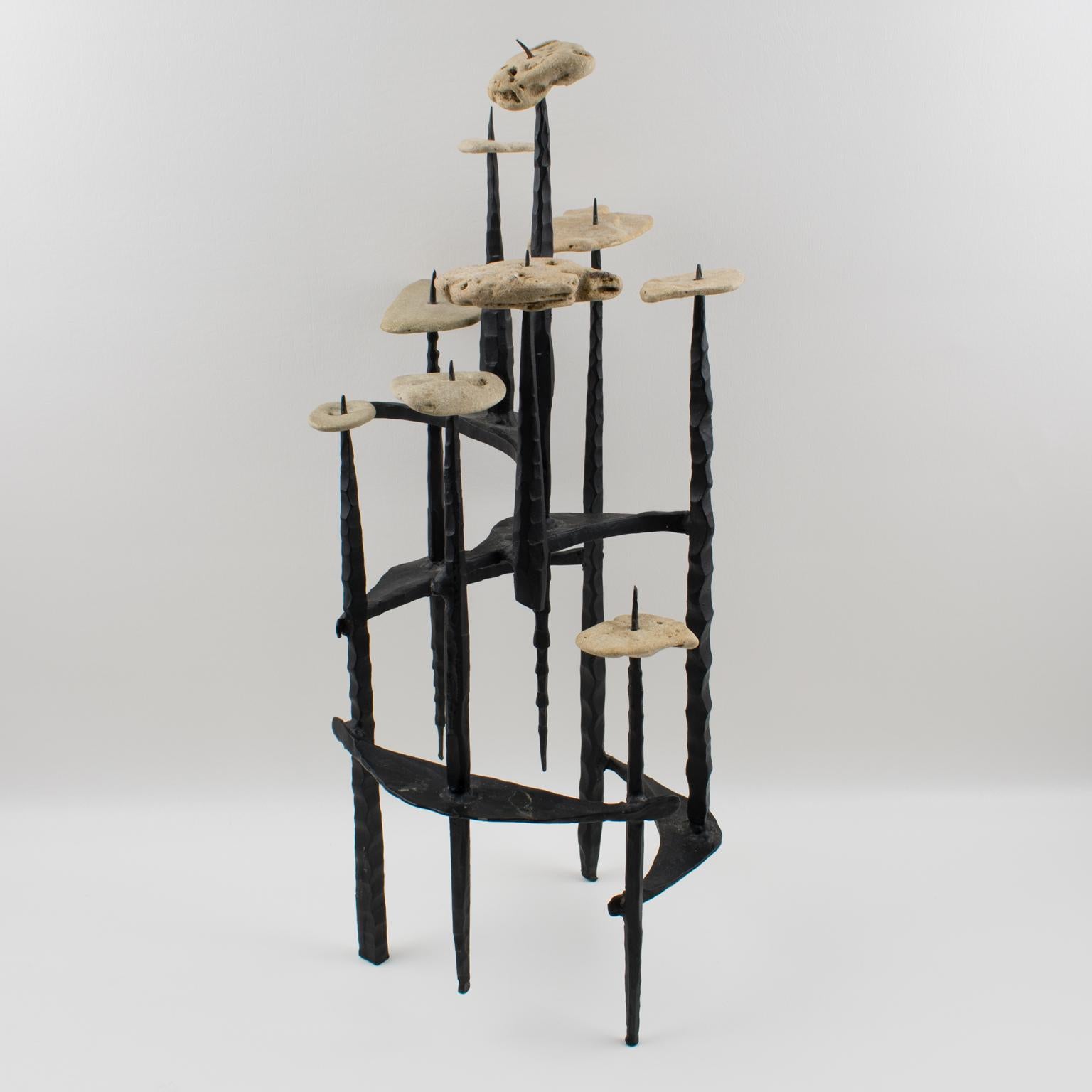 Sculptural menorah or candelabra or Chanukiah by Israeli sculptor David Palombo (1920-1966). Made with welded hammered iron and rocks, it has a very impressive presence. This Brutalist composition features heavy textured hand forged wrought iron