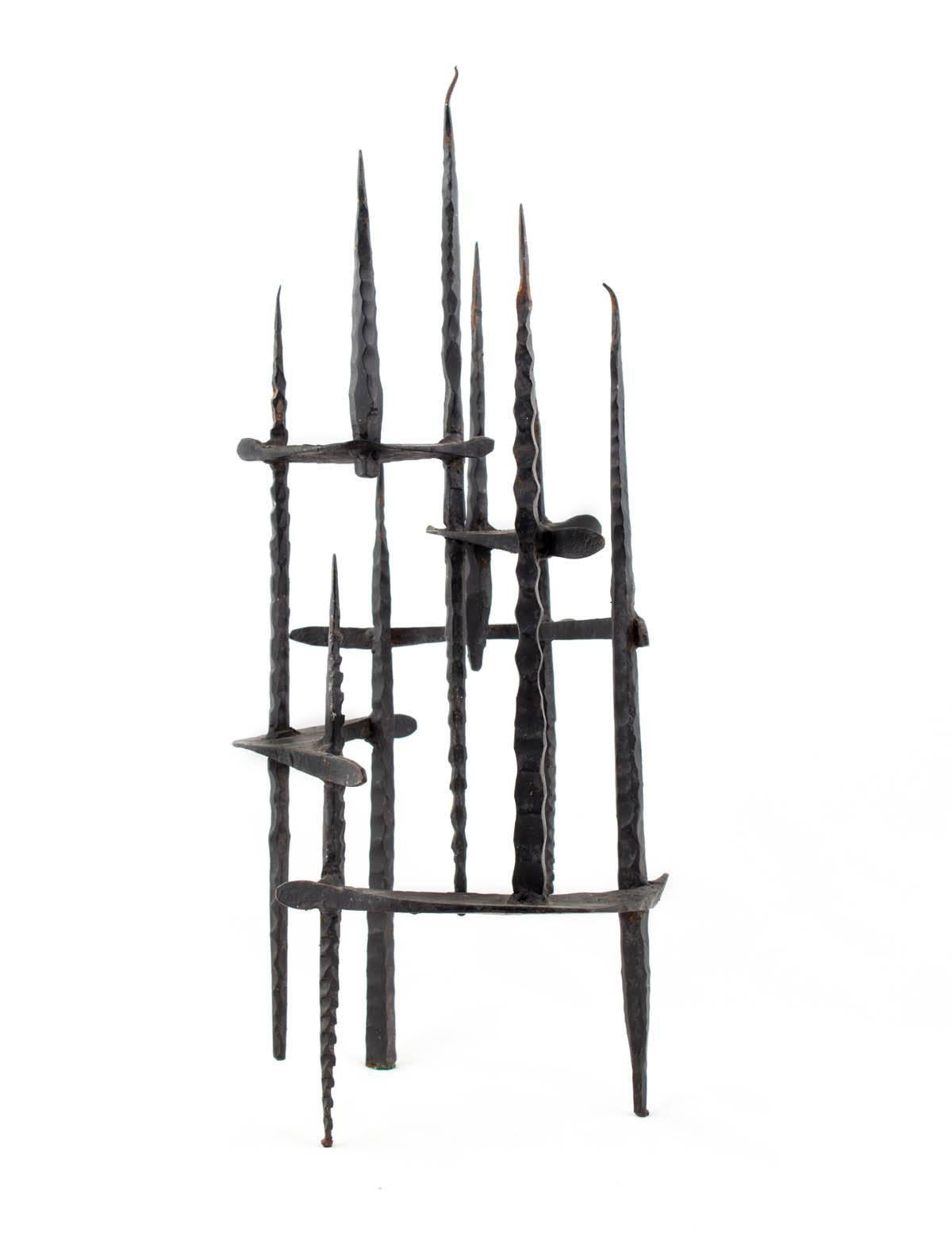Hand Forged Iron Candelabra 
Holocaust Memorial Judaic Menorah Sculpture


David Palombo was an Israeli sculptor and painter. He was born in Turkey and immigrated to the Land of Israel with his parents in 1923. In 1940 he began his studies at
