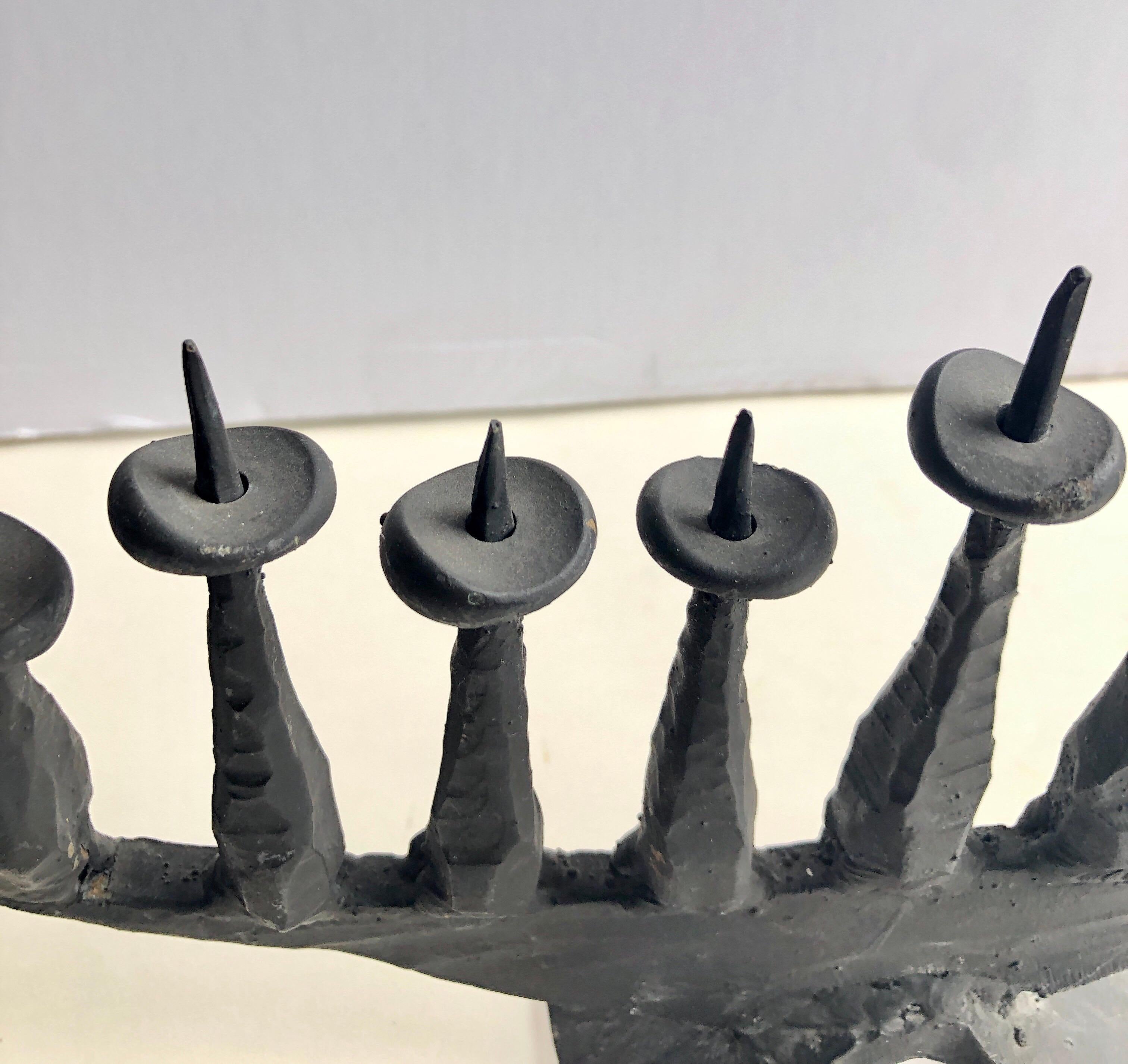 Heavy Hand Forged Brutalist Iron Memorial Menorah Sculpture. 


David Palombo was an Israeli sculptor and painter. He was born in Turkey to a traditional family and immigrated to the Land of Israel with his parents in 1923. They lived in the Nahalat