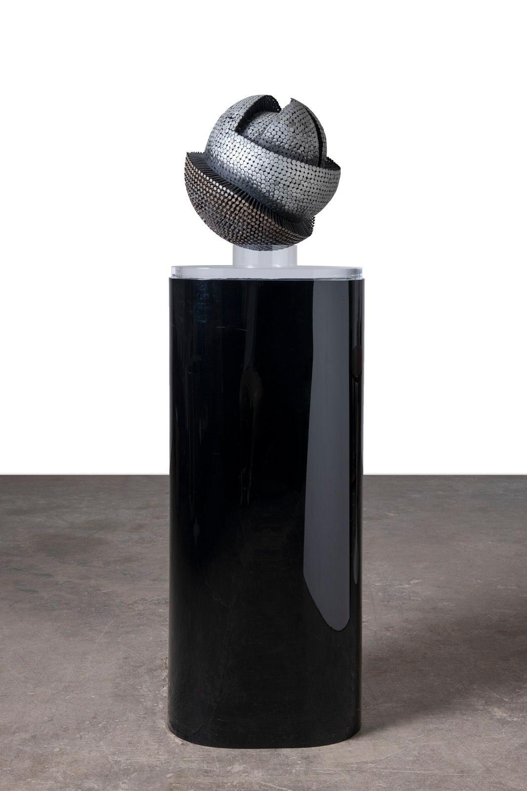 David Partridge nail sculpture from an important private corporate commission. The sculpture can be repositioned on the stand to change the appearance. This is an extraordinary example of Partridge's work.
The custom Illuminated acrylic pedestal can
