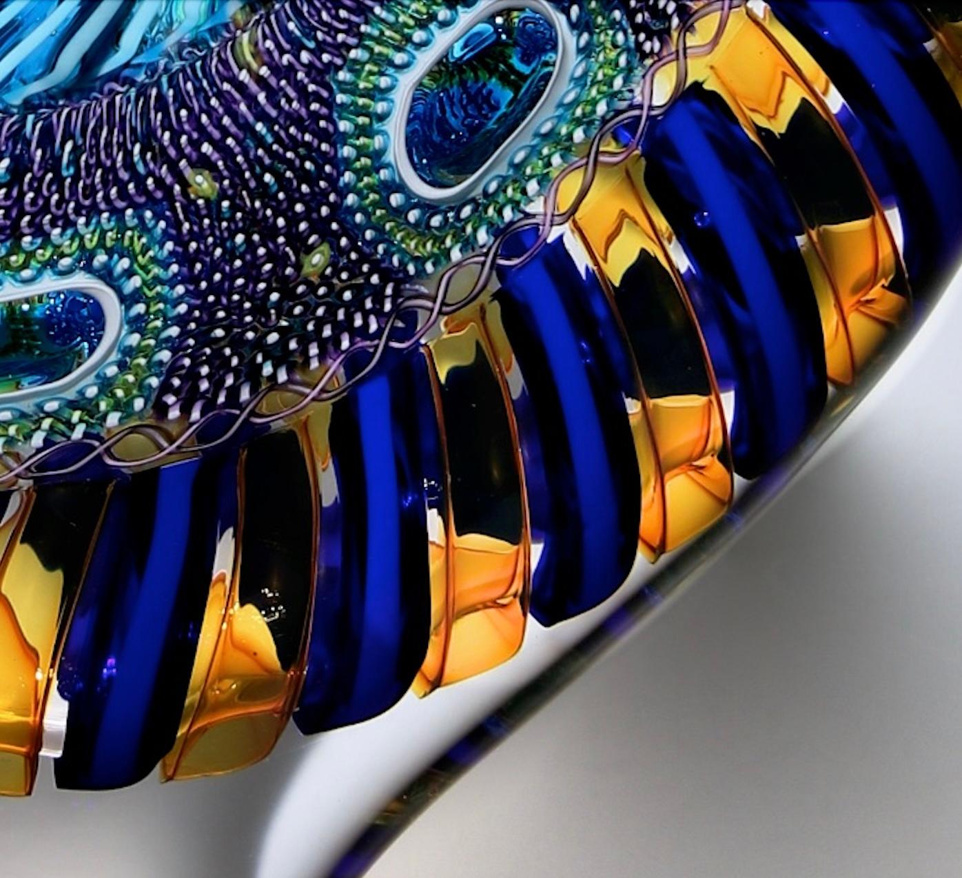 David Patchen creates vivid and luminous glass works using the time-honored techniques of cane and murrine glass blowing, originally discovered in the glass blowing studios of Venice. Patchen studied in the Public Glass studio in San Francisco under