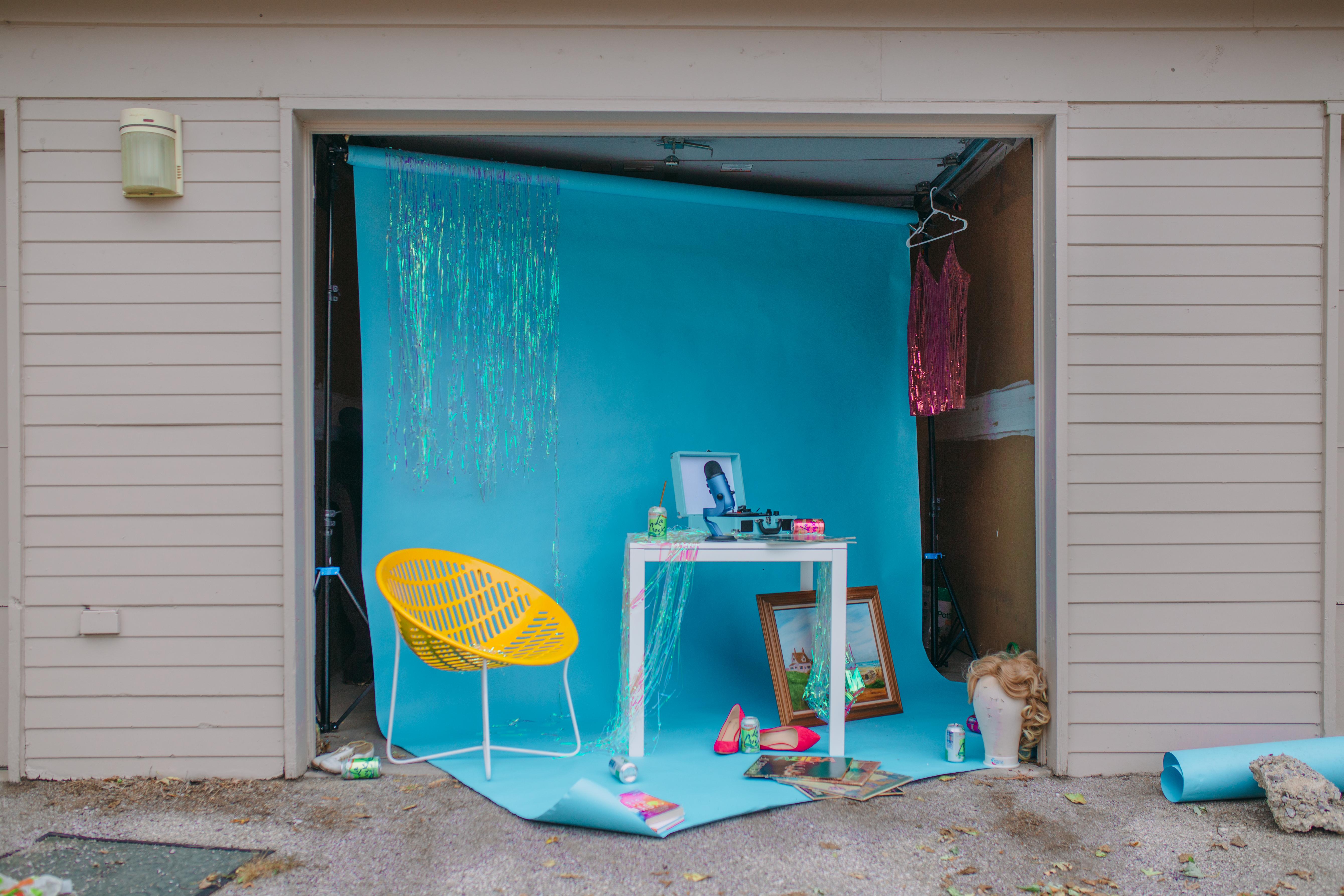 Garage (Garage, Still Life, Backdrop, Chair, Table, Wig, Colorful, Funny) - Photograph by David Pugh
