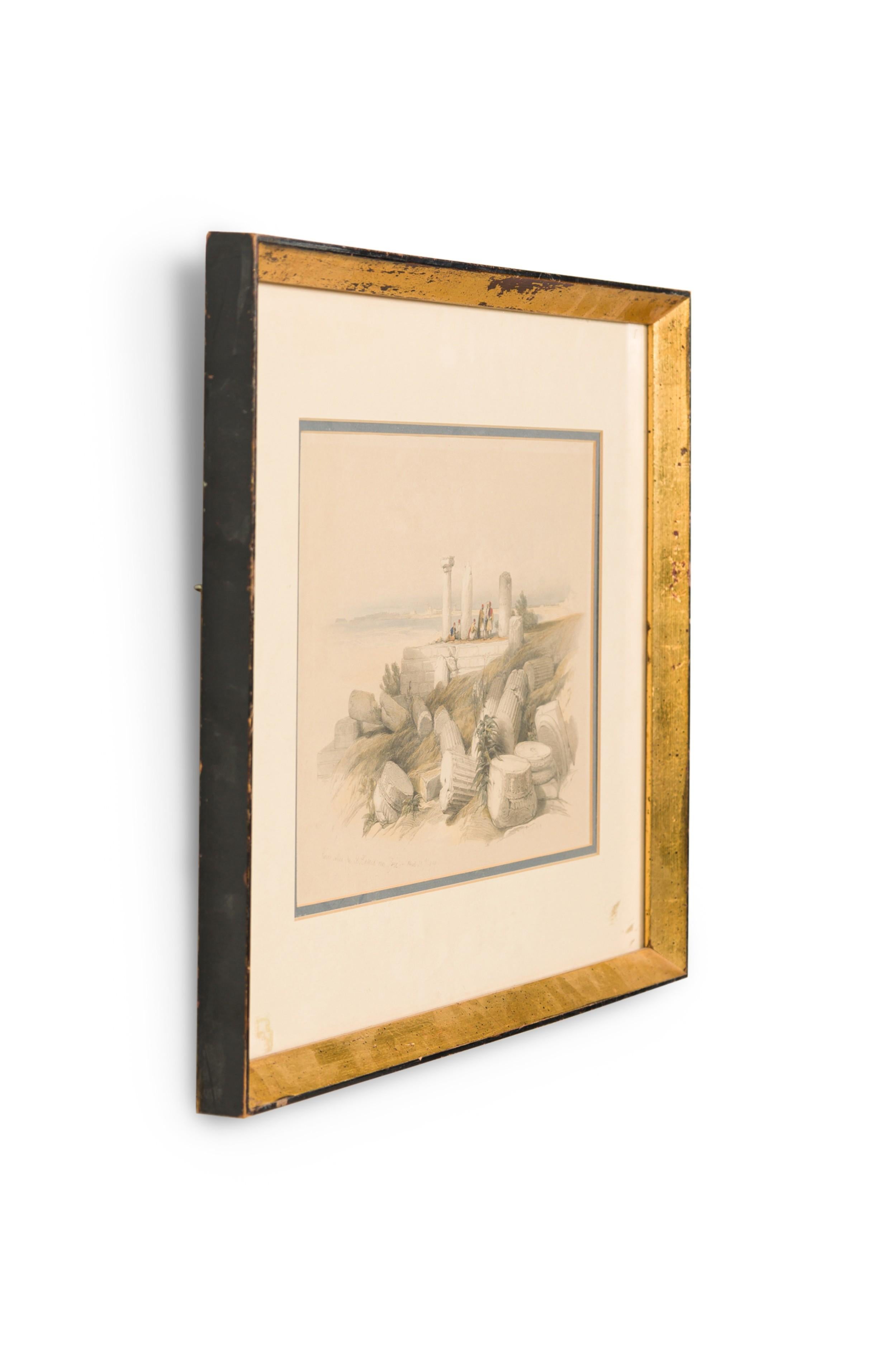 English Georgian (1st half 19th Century) gilt framed colored lithograph of a group of Moorish men on a hillside by ancient damaged stone pillars (titled: Ruins Called Om El Hamed Near Tyre April 25, 1839) (DAVID ROBERTS) (companion to REG9009)