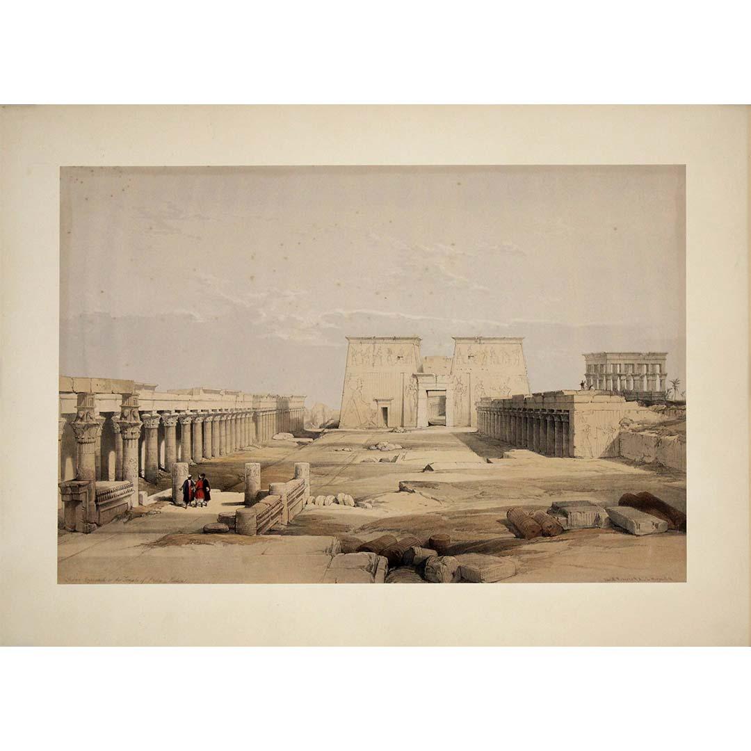 This remarkable lithograph, titled Grande approche du temple de Philae, Nubie, transports us to one of the most iconic temple complexes of ancient Egypt, as seen through the romantic and precise eye of David Roberts (1796–1864). Created during his