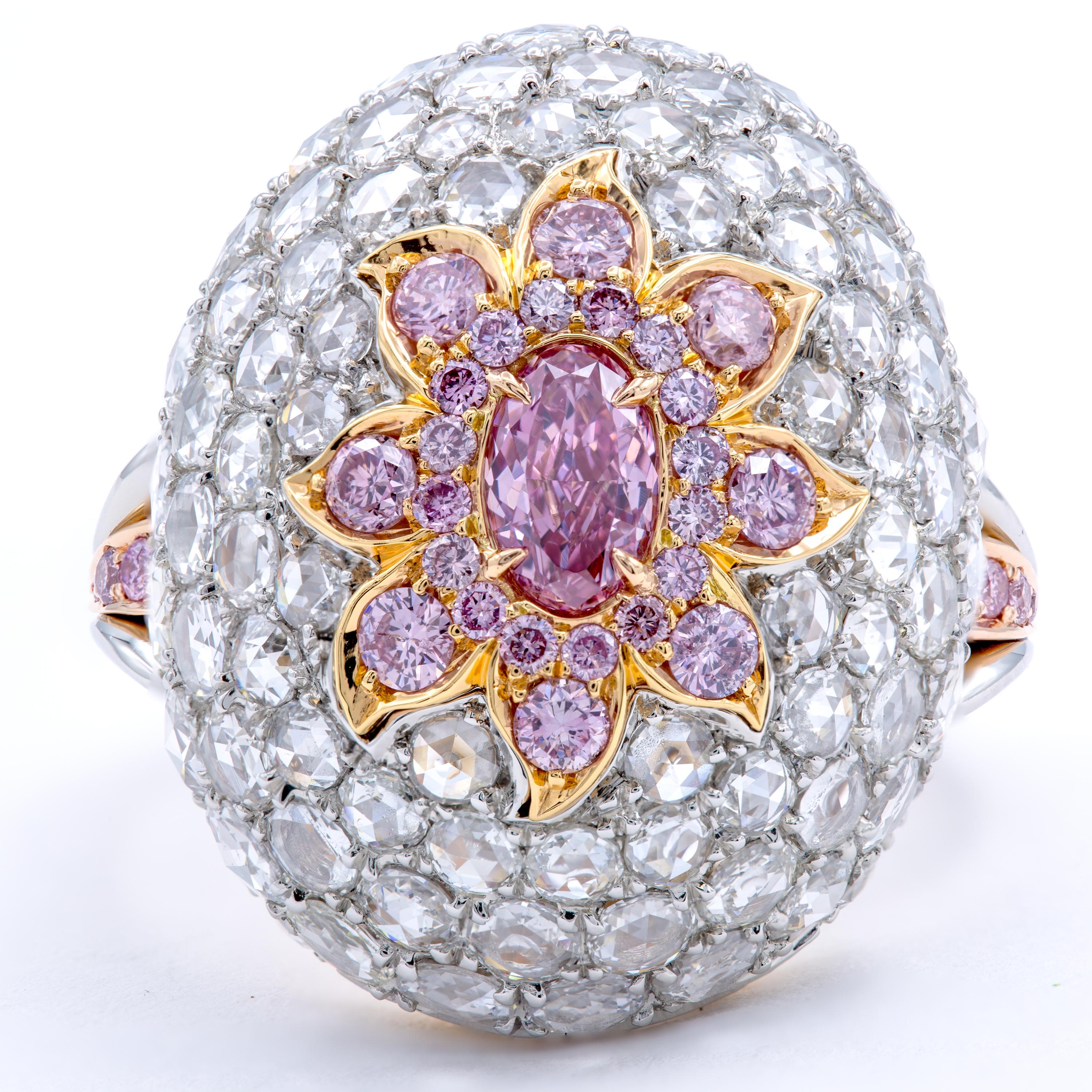 Countless Pavé set white diamonds support this exotic beauty abloom with scintillating petals of pink diamonds and a GIA Certified Natural Fancy Purplish Pink Diamond. This romantic center-stone emanates a rich warm pink color with deeper tones of