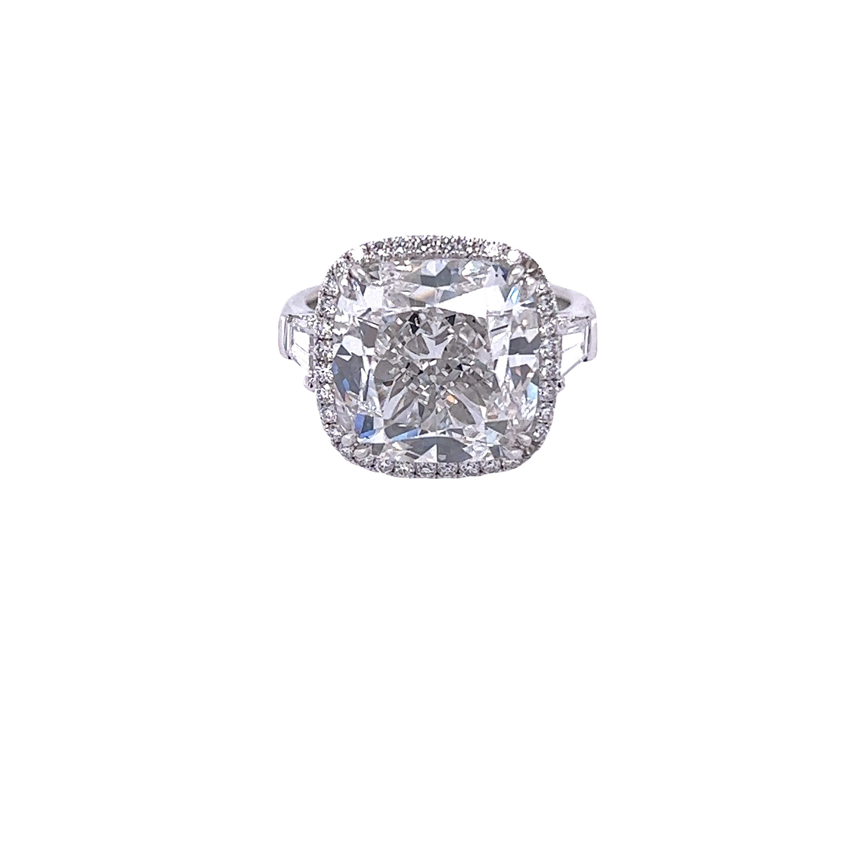 Rosenberg Diamonds & Co. 10.02 carat Cushion cut E color VS2 clarity is accompanied by a GIA certificate. This spectacular Cushion is full of brilliance and it is set in a handmade platinum setting with perfectly matched pair of trapezoid side