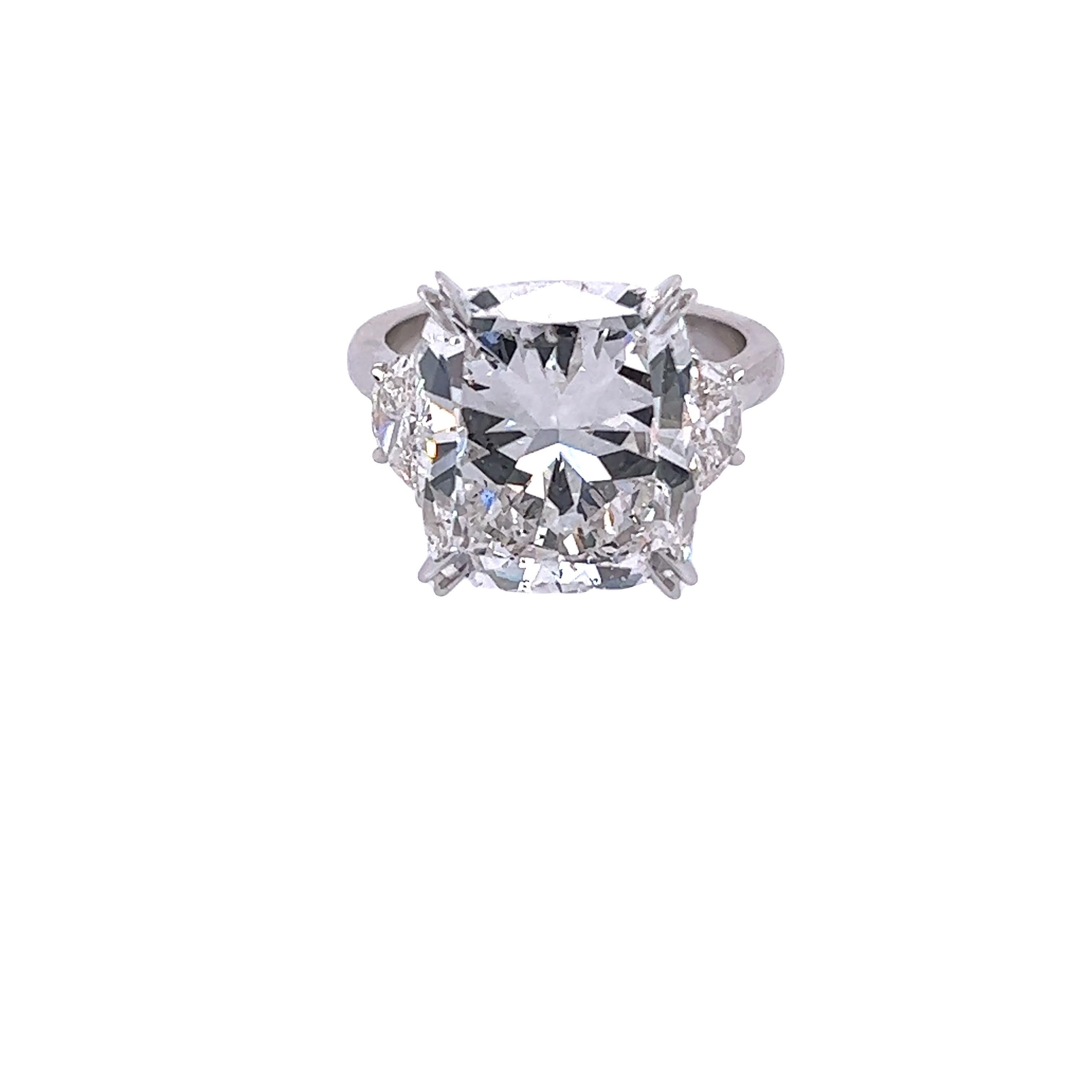 Rosenberg Diamonds & Co. 10.10 carat Cushion cut G color SI2 clarity is accompanied by a GIA certificate. This spectacular cushion is full of brilliance and it is set in a handmade platinum  setting with perfectly matched pair of epaulette side