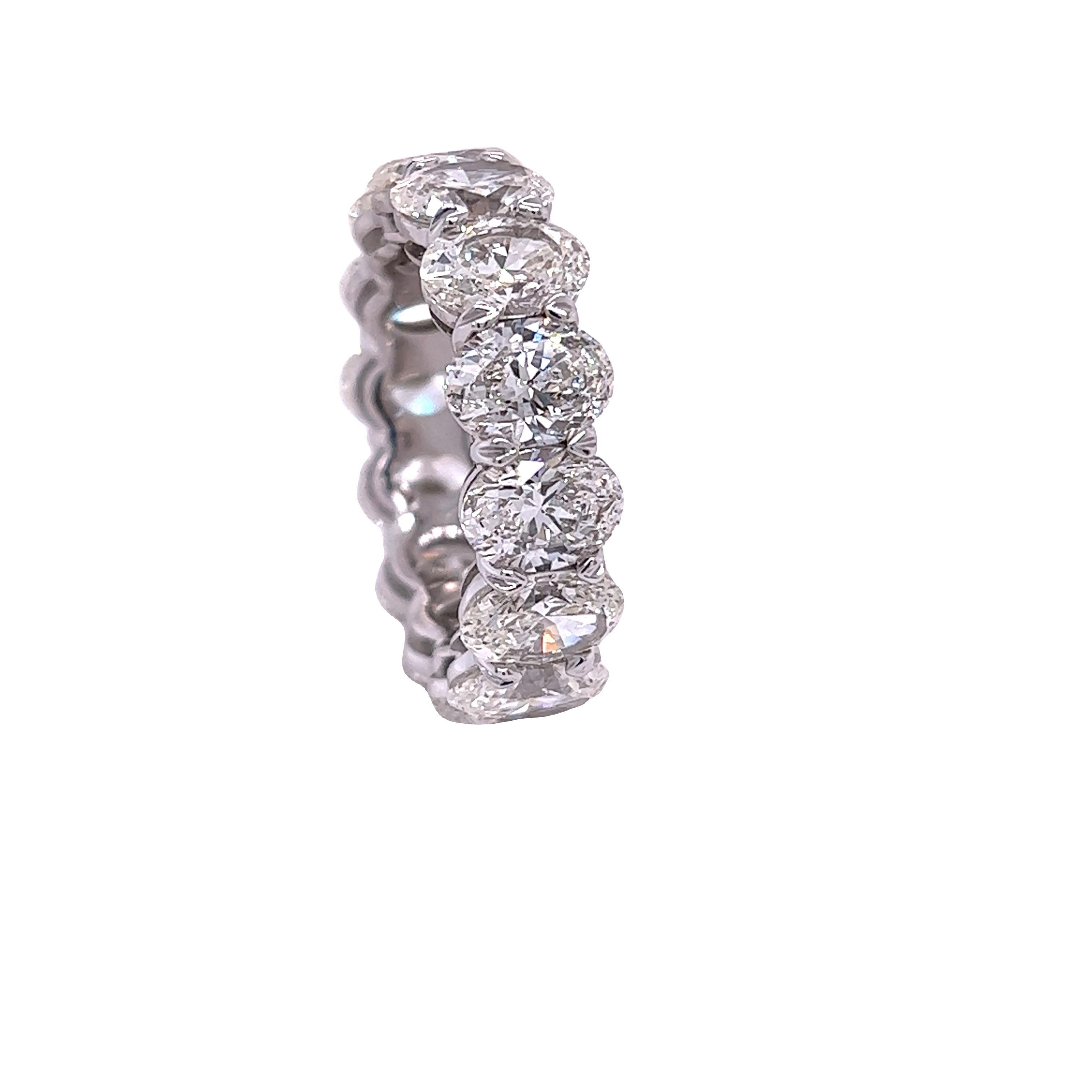 Rosenberg Diamonds & Co. 10.11 total carat weight Oval shape diamond eternity band. This beautiful platinum eternity band has fourteen oval shape diamonds ranging from G-H in color VVS1-SI2 in clarity with just under one carat each, all accompanied