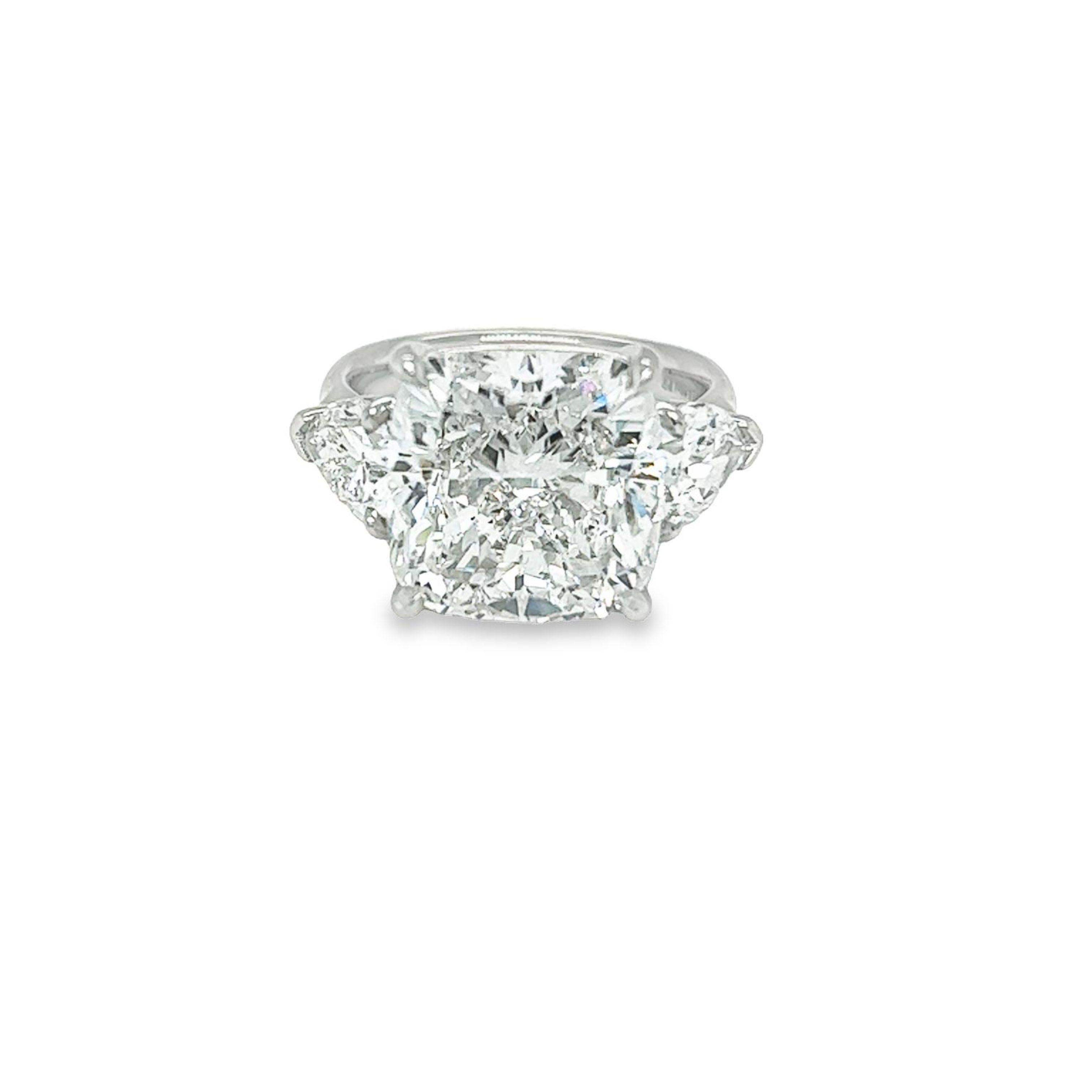 Rosenberg Diamonds & Co. 10.08 carat Cushion cut F color SI2 clarity is accompanied by a GIA certificate. This spectacular three stone cushion is set in a handmade platinum setting with perfectly matched pair of Pear shape side stones flanking on