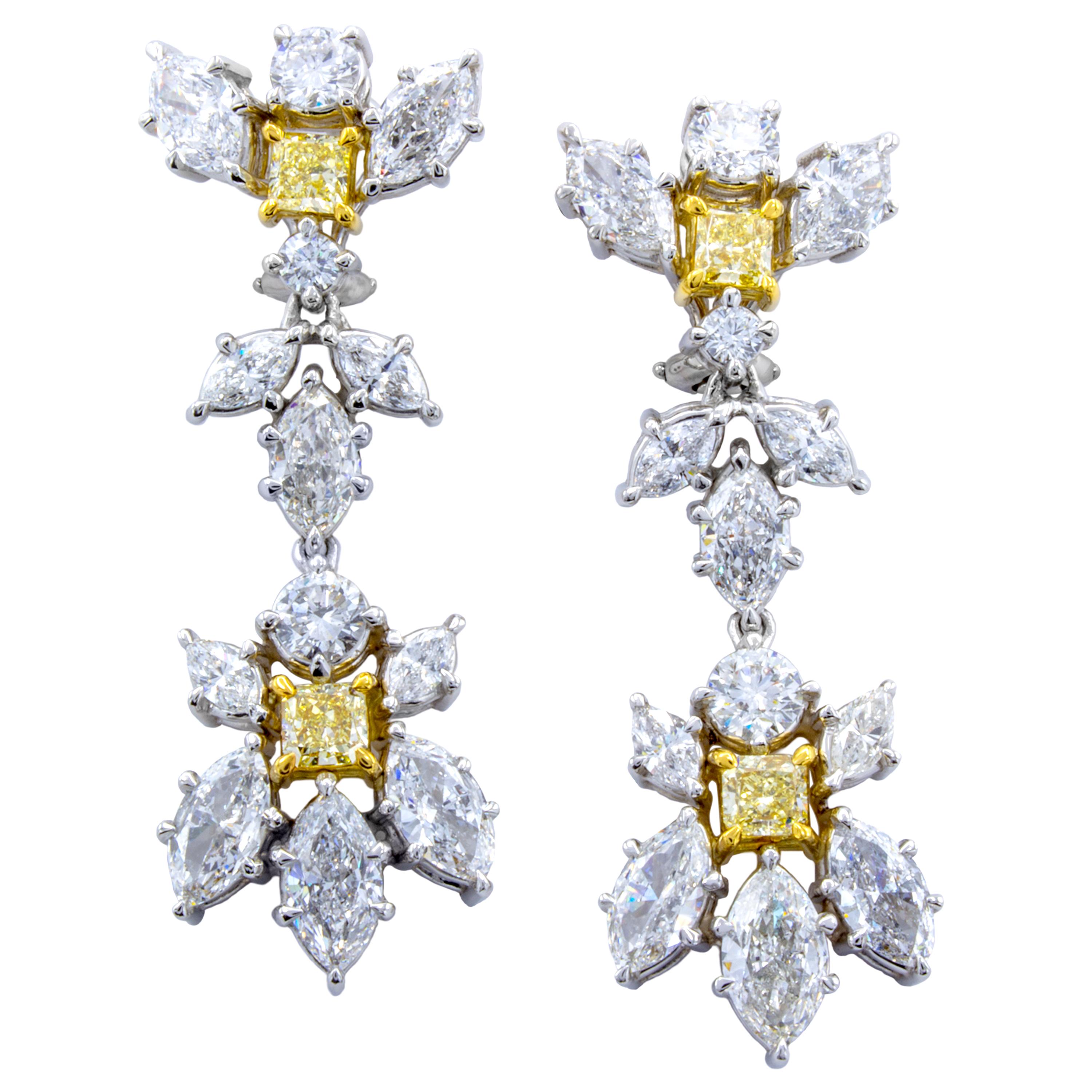 Brilliance in color and light captures the heart with these drop dangle earrings from Rosenberg Diamonds & Co. 18Kt white and yellow gold settings delicately embrace 10.38 carats of multi shaped white and fancy intense yellow diamonds to incredible