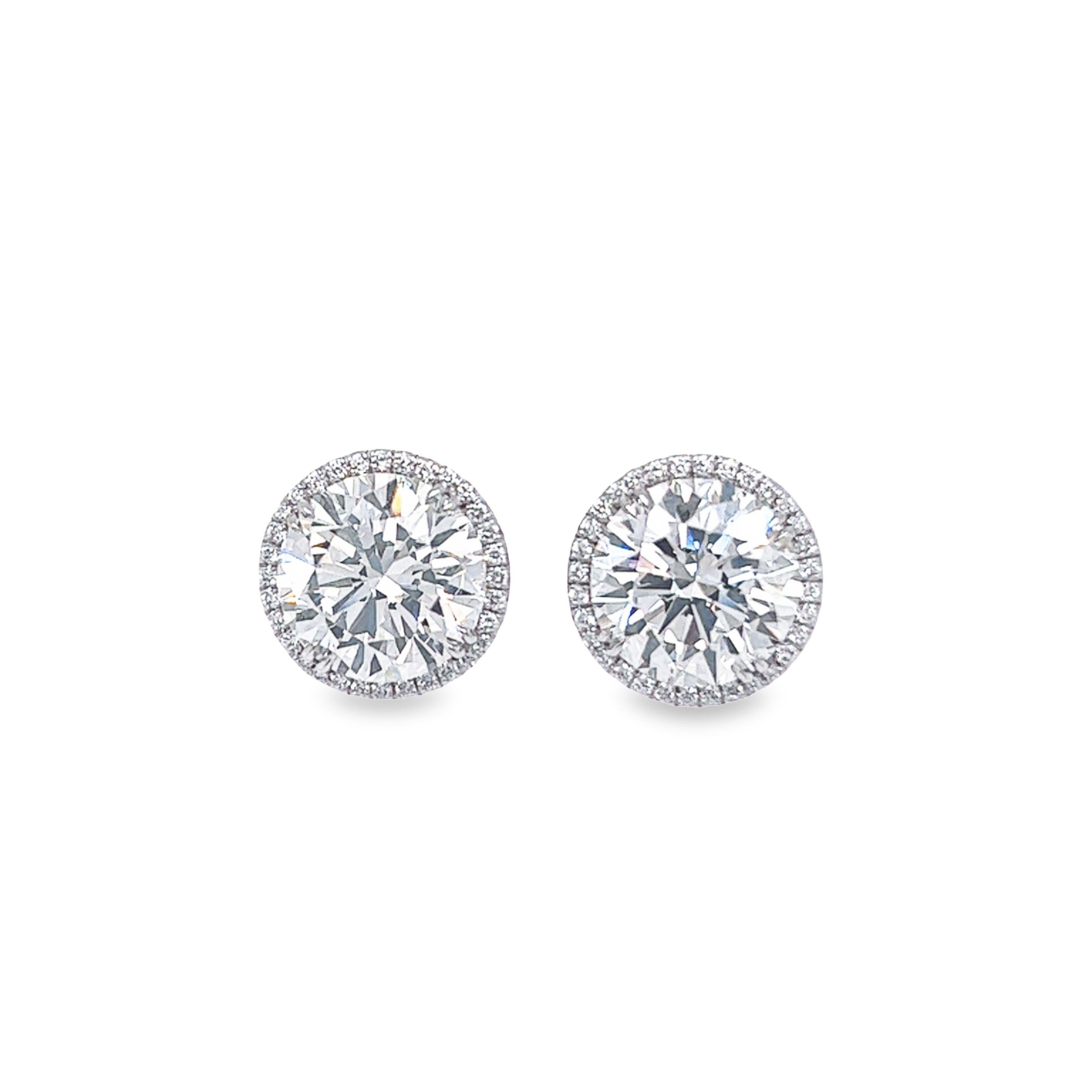 Rosenberg Diamonds & Co. 10.46 total carat weight I color IF - VS1 clarity GIA Certified is the perfect pair of diamond studs set in 18k white gold and a beautiful pave halo with a total of .34 carats. We have a large selection of GIA Certified