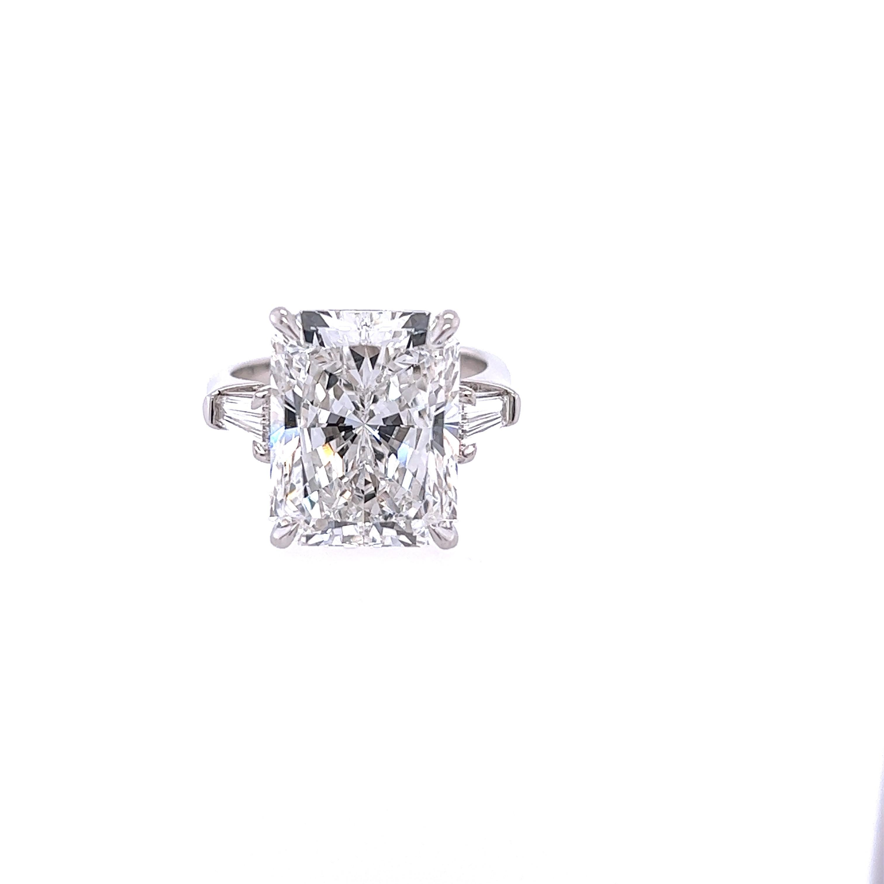 Rosenberg Diamonds & Co. 10.55 carat Radiant cut F color VS2 clarity is accompanied by a GIA certificate. This gorgeous elongated Radiant cut is full of brilliance and it is set in a handmade platnium setting with perfectly matched pair of tapered