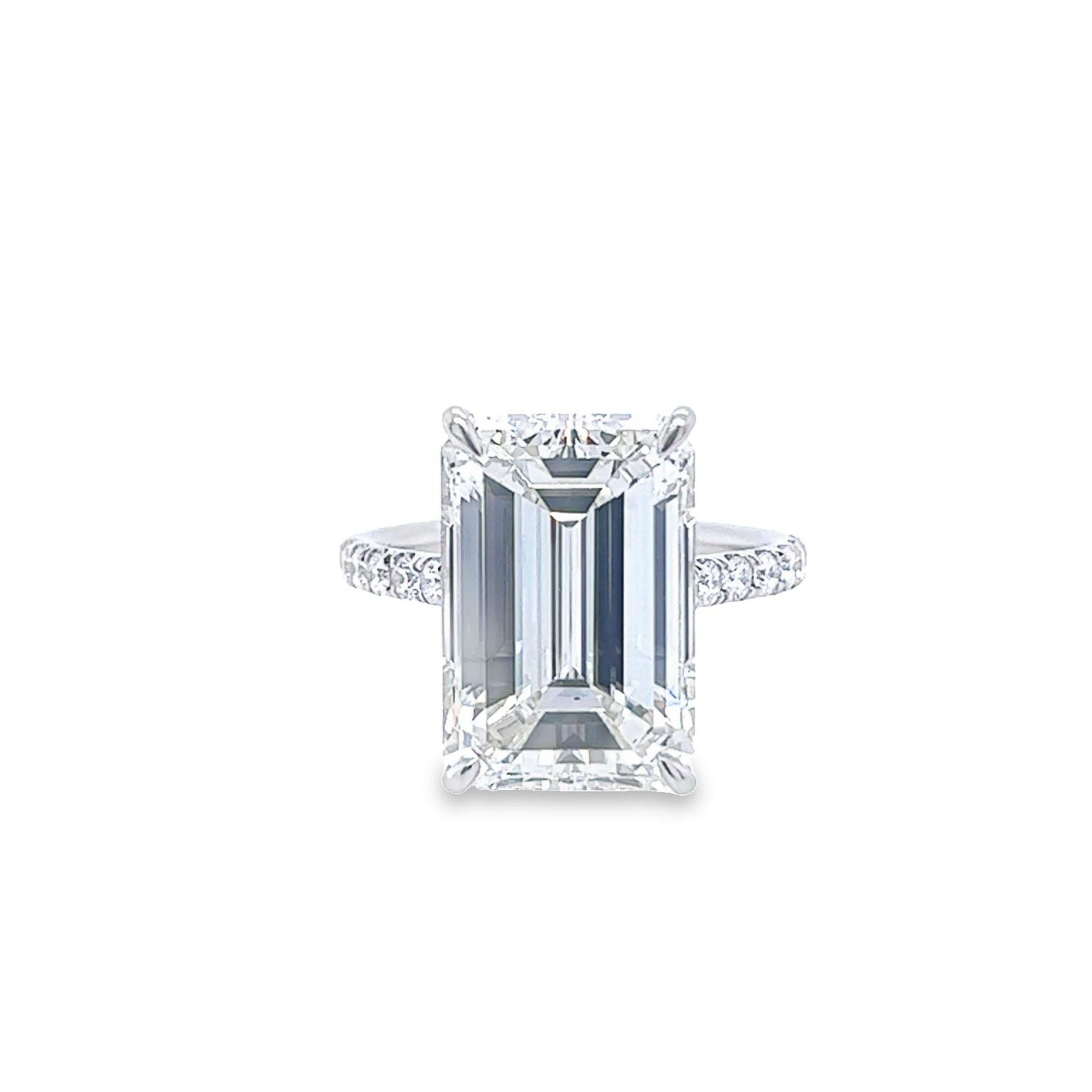 Rosenberg Diamonds & Co. 10.86 carat Emerald cut I color VS2 clarity is accompanied by a GIA certificate. This breathtaking Emerald is full of brilliance and it is set in a handmade platinum setting and continues its elegance with a row of micro