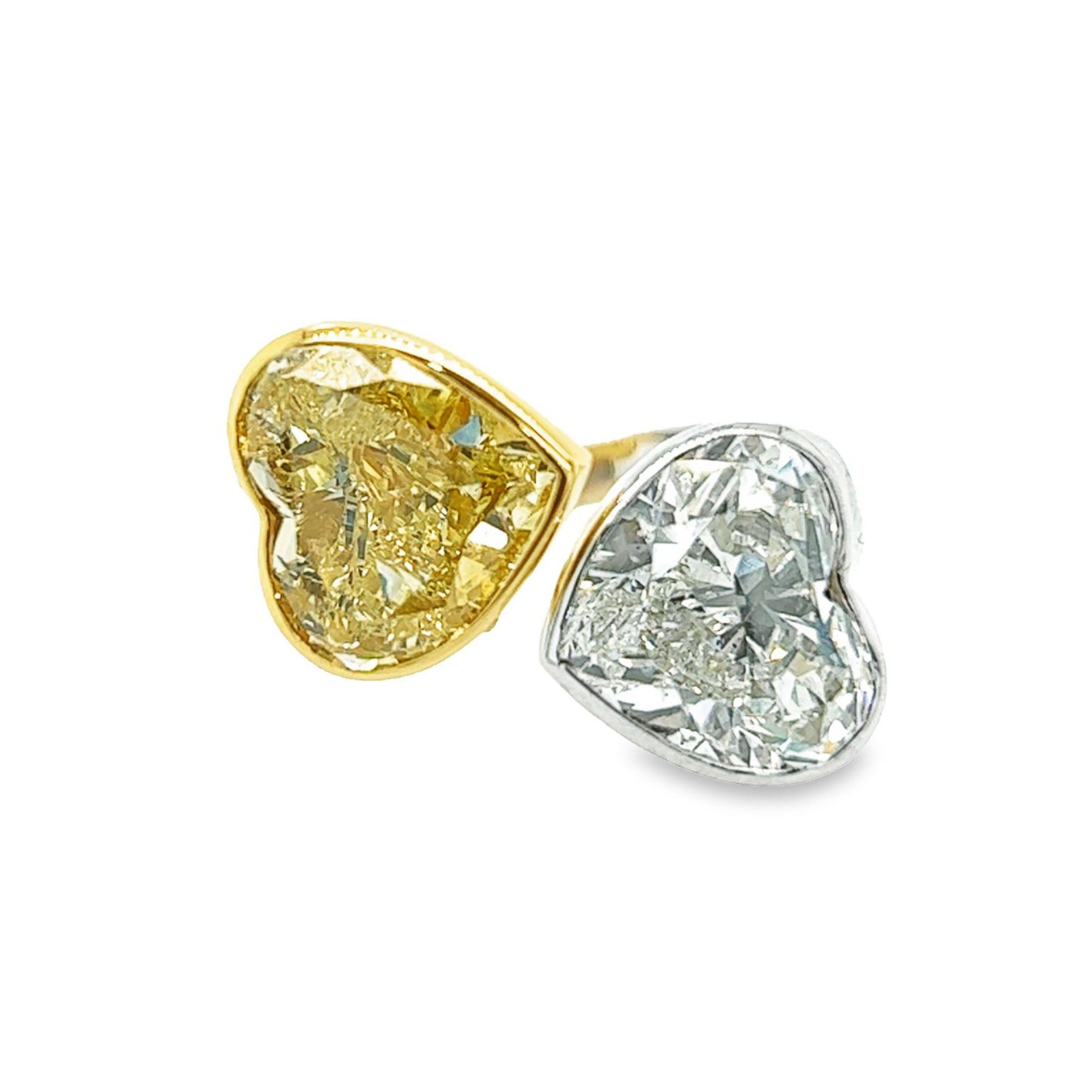 Rosenberg Diamonds & Co. 11.11 carat total weight Heart shape 5.19 carat Fancy Light Yellow SI1 clarity, 5.92 carat Heart shape J/SI2 clarity are both accompanied by a GIA certificate. This gorgeous unique by pass ring is full of fire and is an