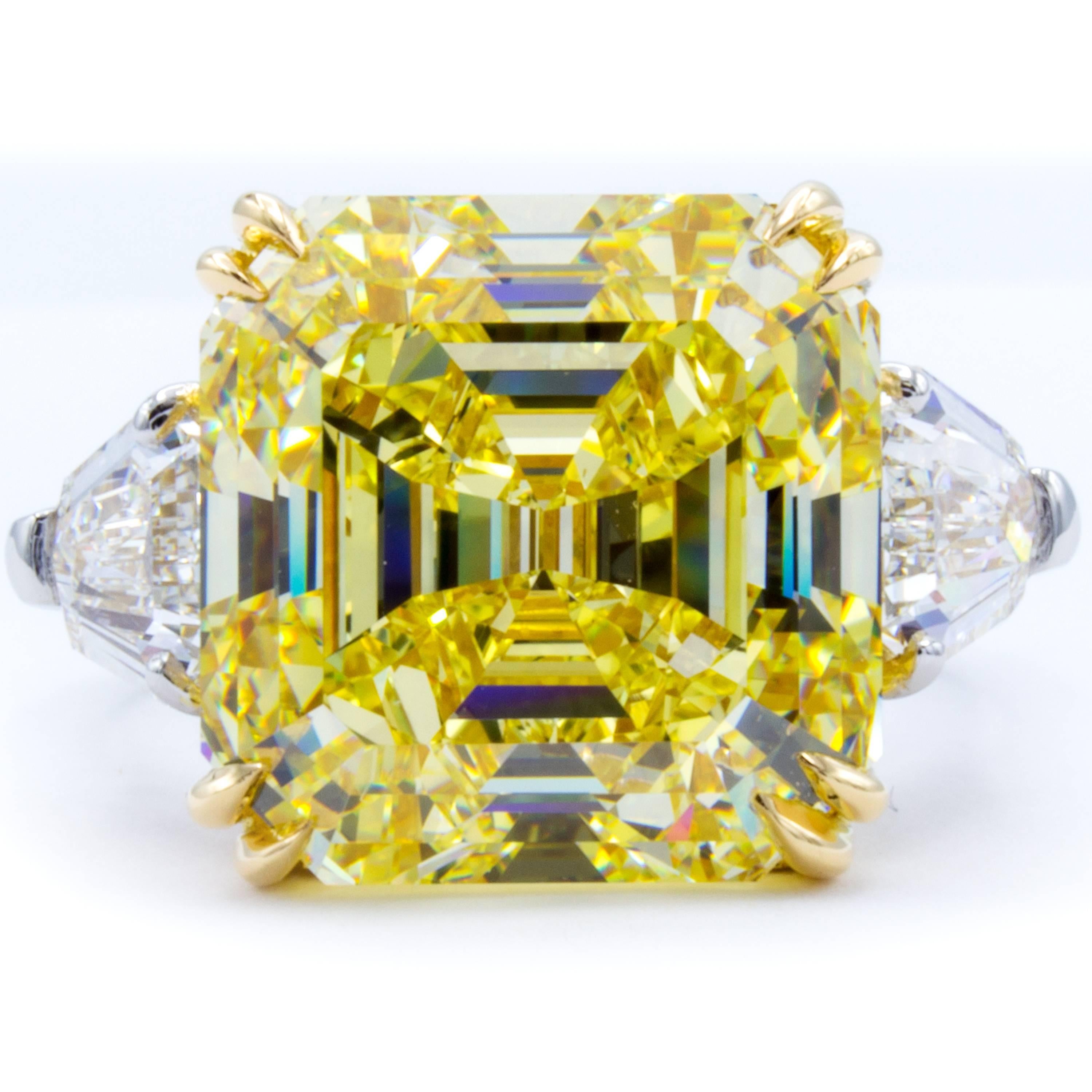 An impossible beauty emerges in this Rosenberg Diamonds & Co. engagement ring. An incredibly rare GIA certified 11.62 carat square emerald/asscher cut diamond captures the imagination with natural fancy intense yellow color and VVS2 clarity. The