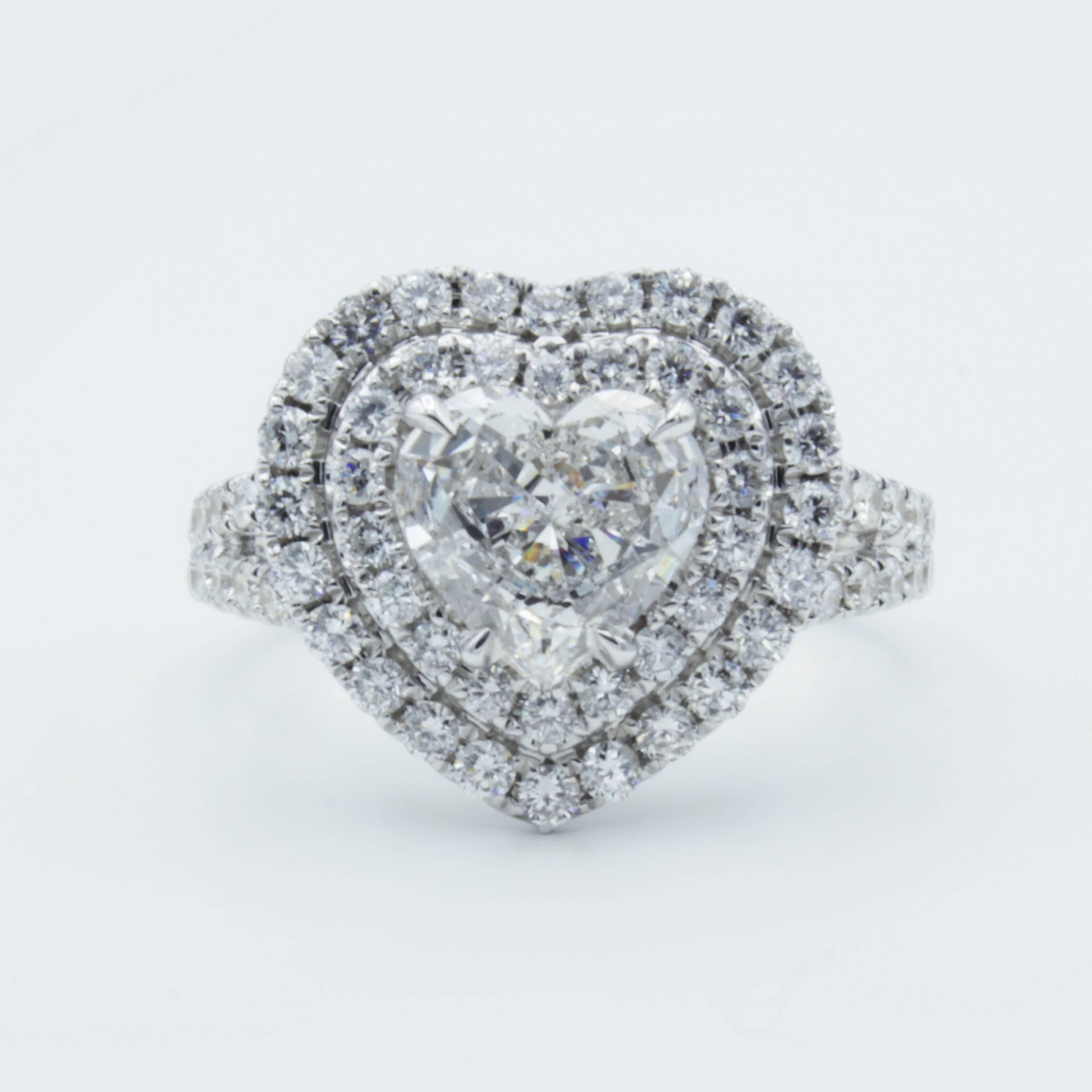 This gorgeous Rosenberg Diamonds & Co. engagement ring displays a beautiful range of sparkling colors within  1.18 carat Heart shaped diamond. A setting of 18Kt white gold displays just under a carat of sparkling pave set diamond accents across the