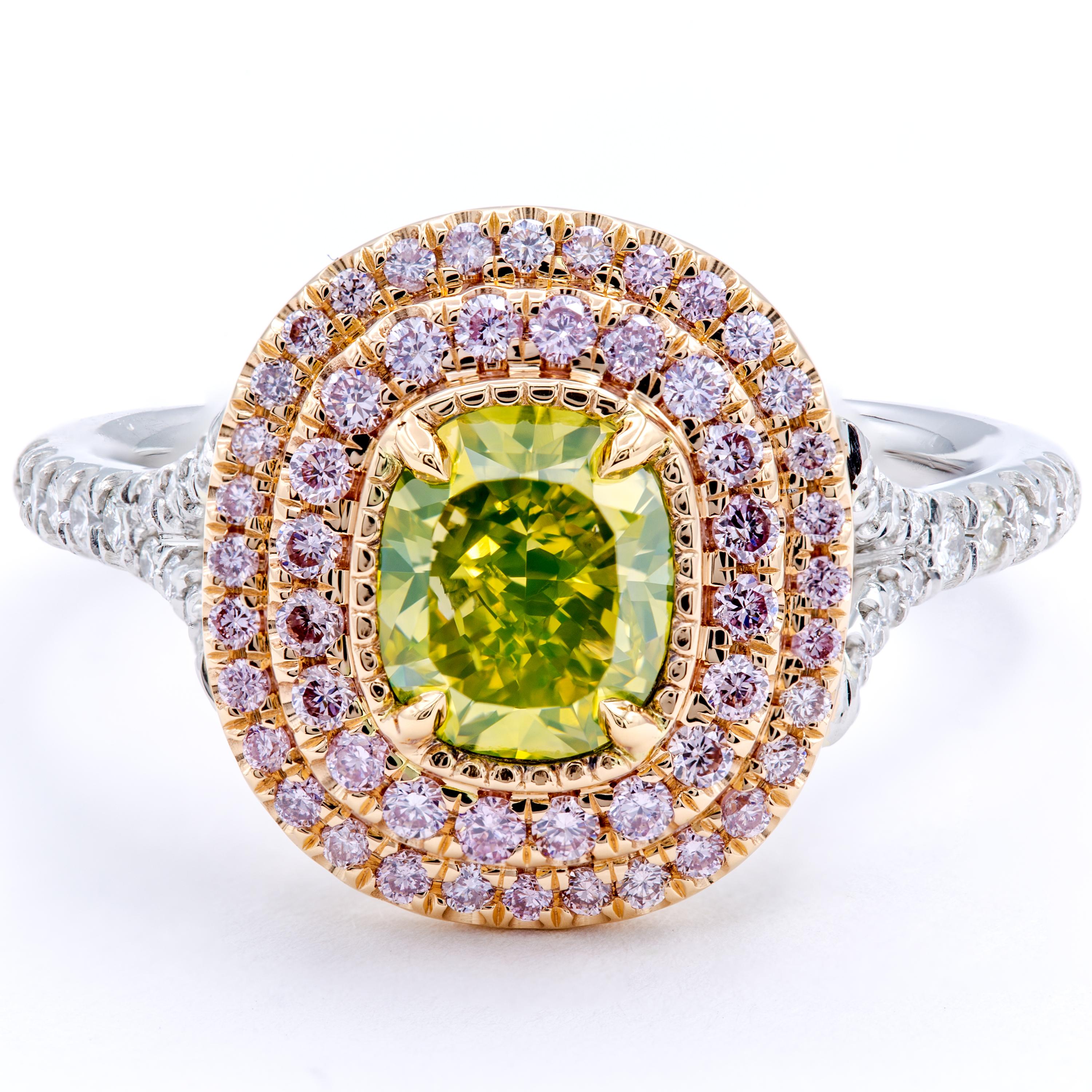Gorgeous rows of natural fancy pink pavé diamonds caress a beautiful natural fancy intense greenish yellow cushion cut diamond center stone. The band uses both platinum and 18Kt white and yellow gold to secure the stones and includes round brilliant