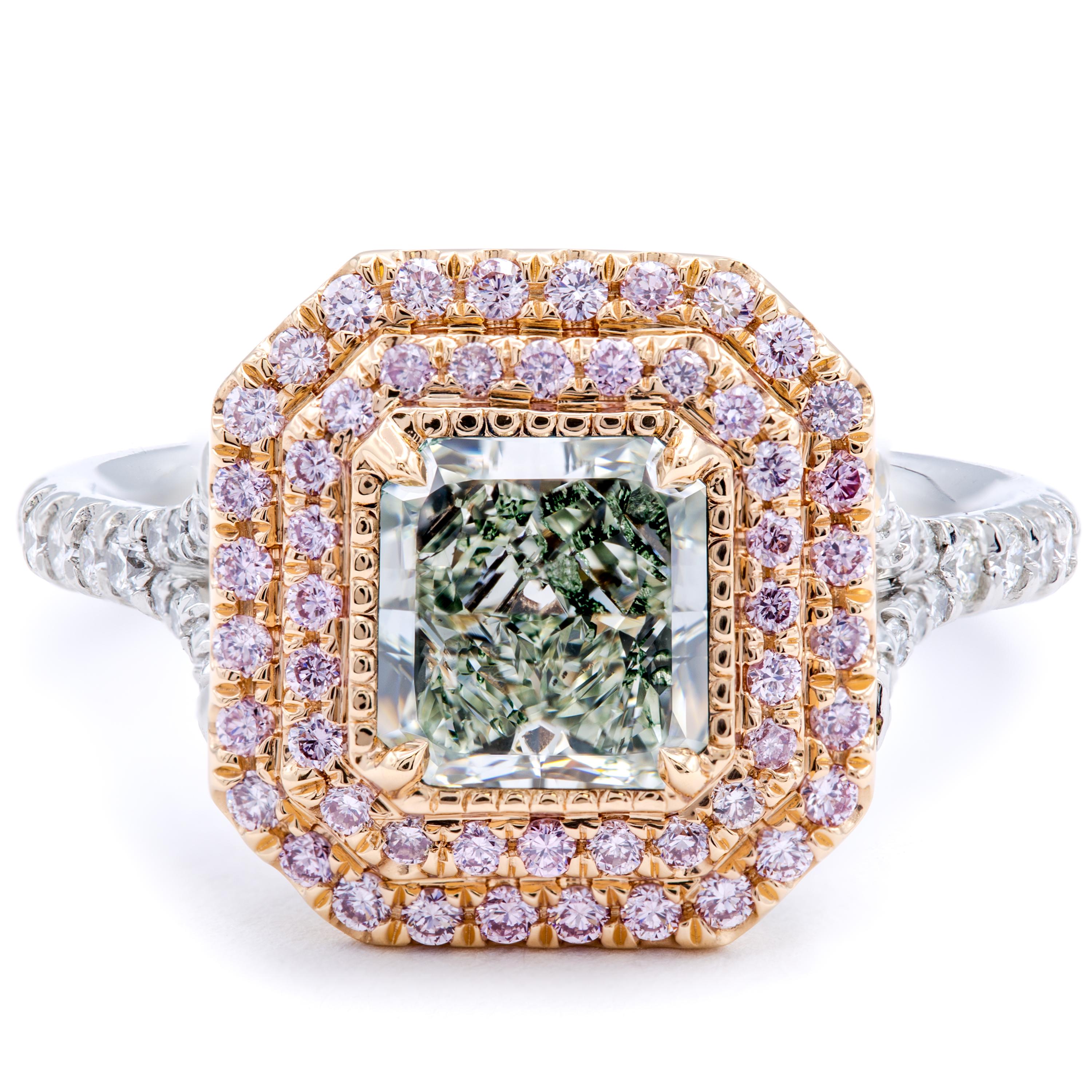 A delectable contrast in colors amounts in a stunning engagement ring designed by David Rosenberg. A band of pure platinum sets white round brilliant pave diamonds around the finger that blend seamlessly into a double halo of natural fancy pink