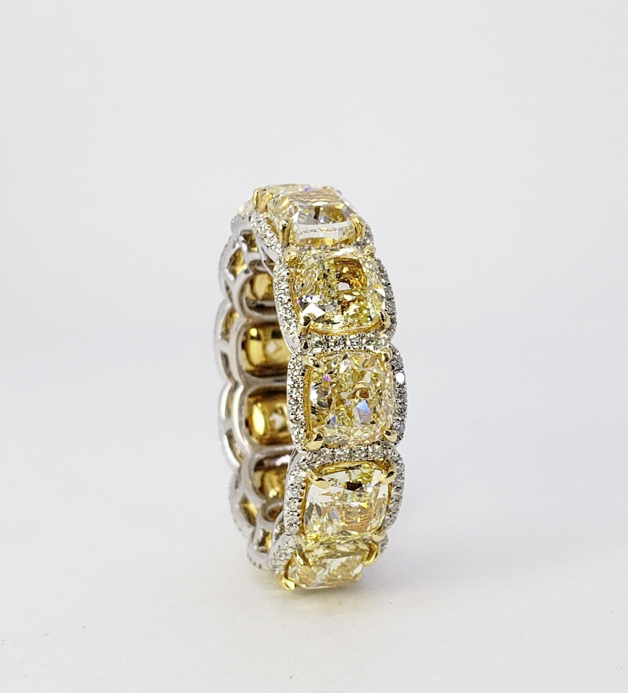 Rosenberg Diamonds & Co. 12.74 total carat weight Cushion cut Fancy Yellow SI-VS clarity. This beautiful yellow diamond eternity band is set in a handmade 18 karat yellow gold setting, with twelve carefully matched cushion shape diamonds surrounded