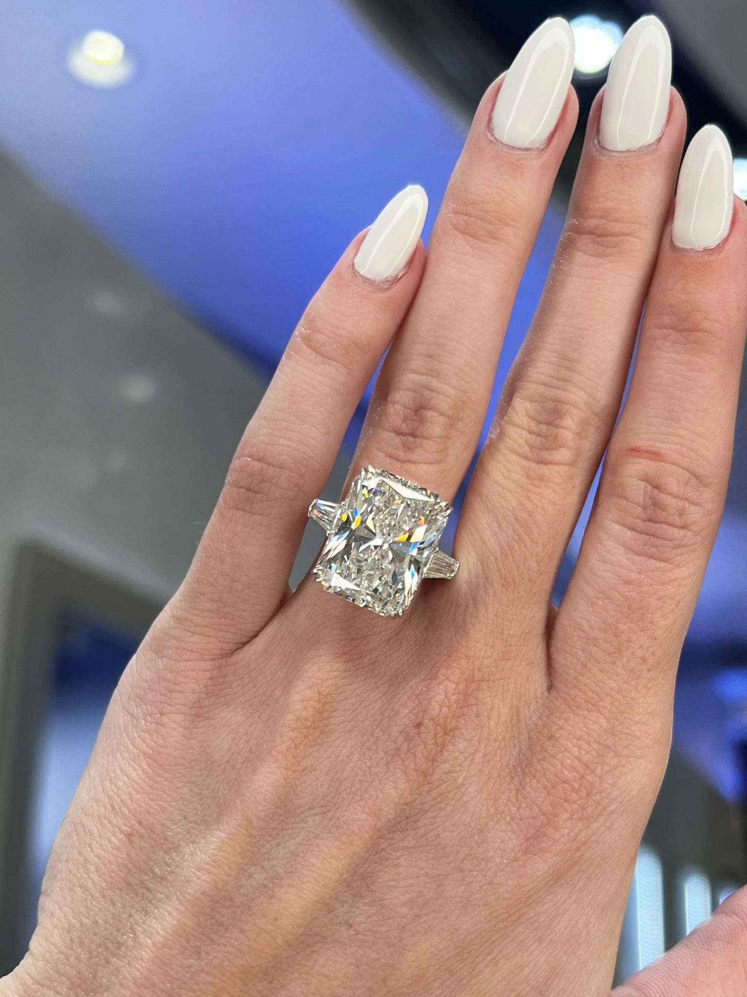 Rosenberg Diamonds & Co. 15.03 carat Radiant cut G color SI1 clarity is accompanied by a GIA certificate. This spectacular 
Radiant is full of brilliance and an exceptional SI1 that is set in a handmade platinum setting with perfectly matched pair