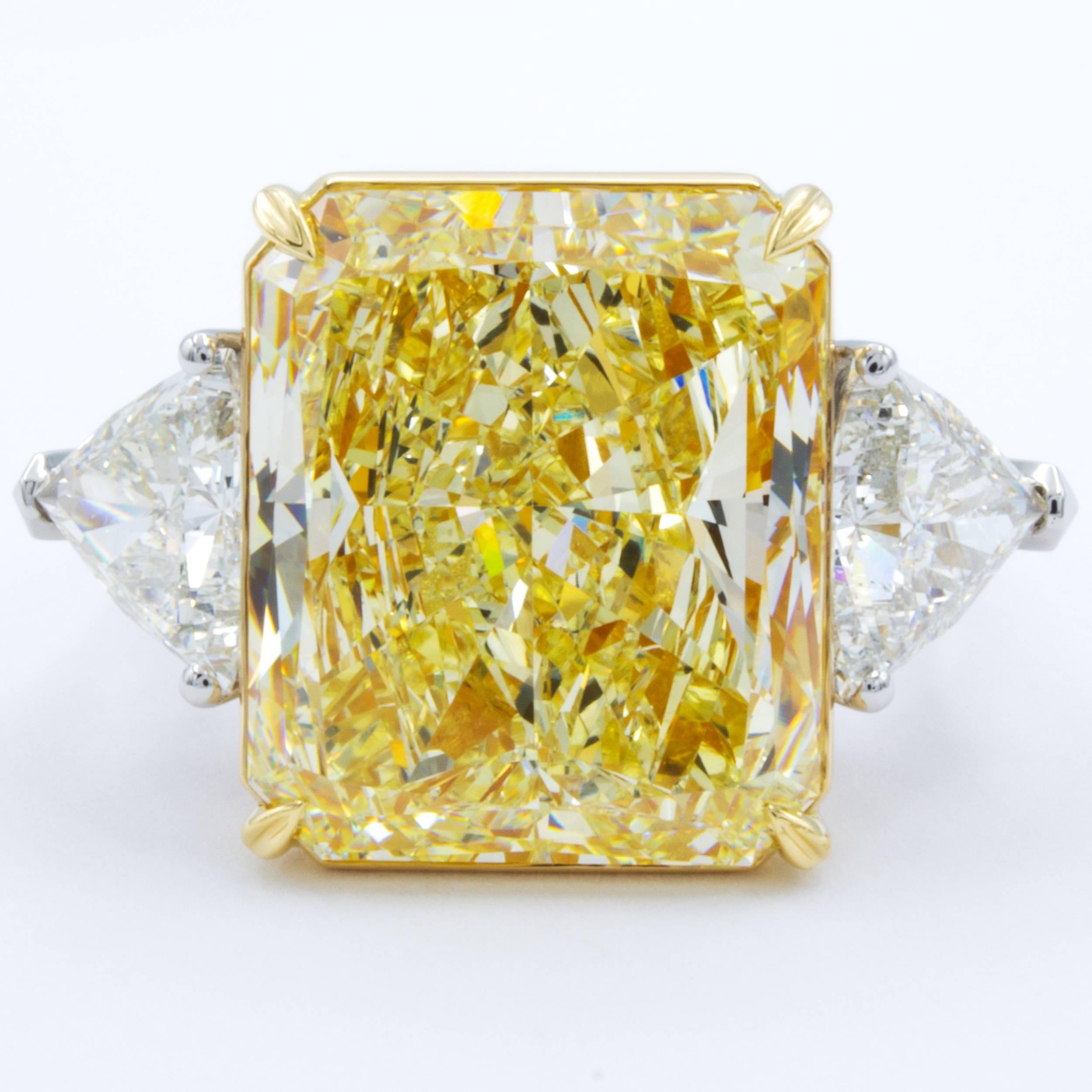 Rosenberg Diamonds & Co. 15.34 carat Radiant cut Fancy Light Yellow VS1 clarity is accompanied by a GIA certificate. This Exceptionally rare Radiant is full of brilliance and it is set in a handmade platinum and 18 karat yellow gold setting with