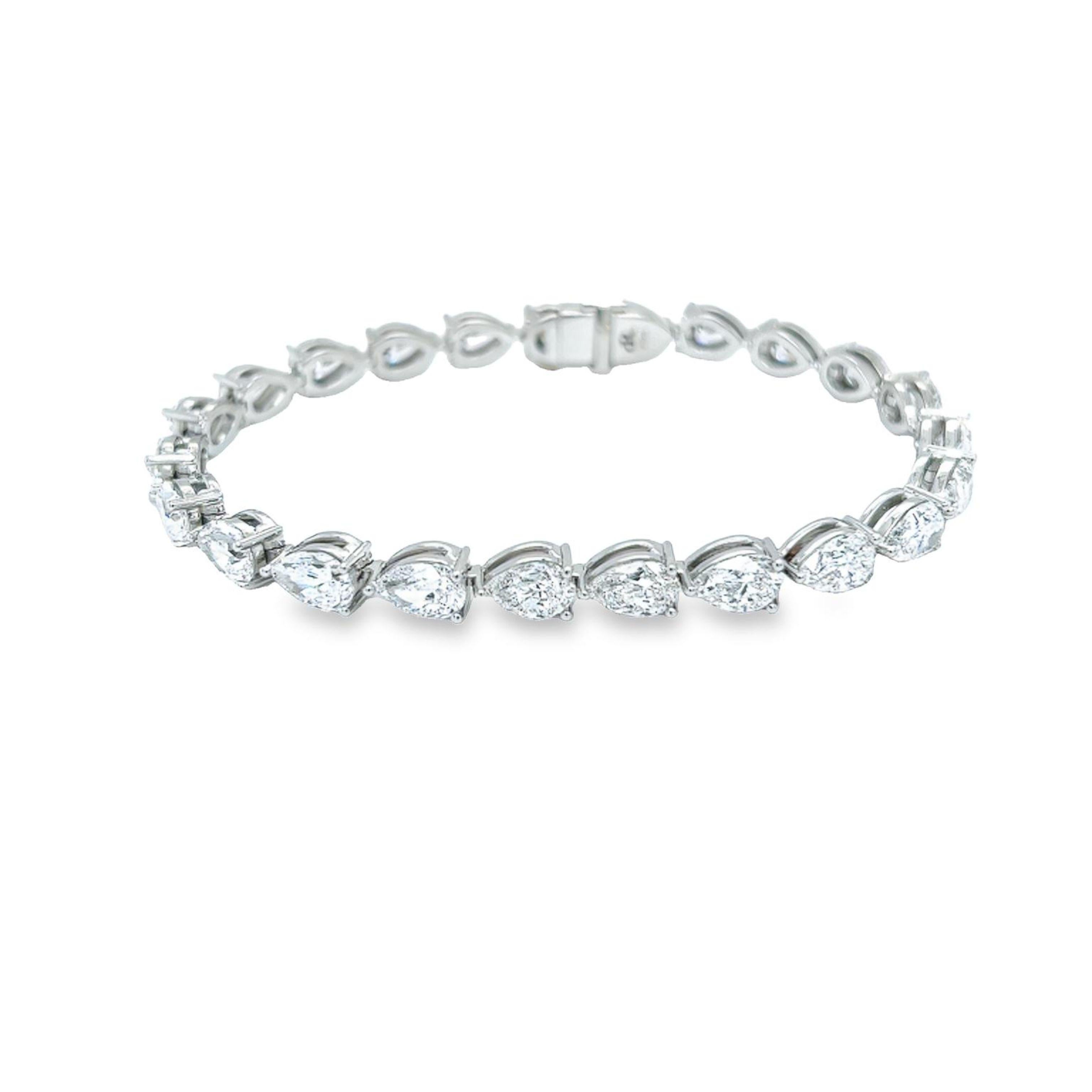 Rosenberg Diamonds & Co. 16.13 carat total weight Pear shape diamond tennis bracelet set in platinum 7 inch. This beautiful straight line bracelet consists of .70 carats, D-F in color VS2-IF in clarity. Each 23 stones are perfectly matched, top