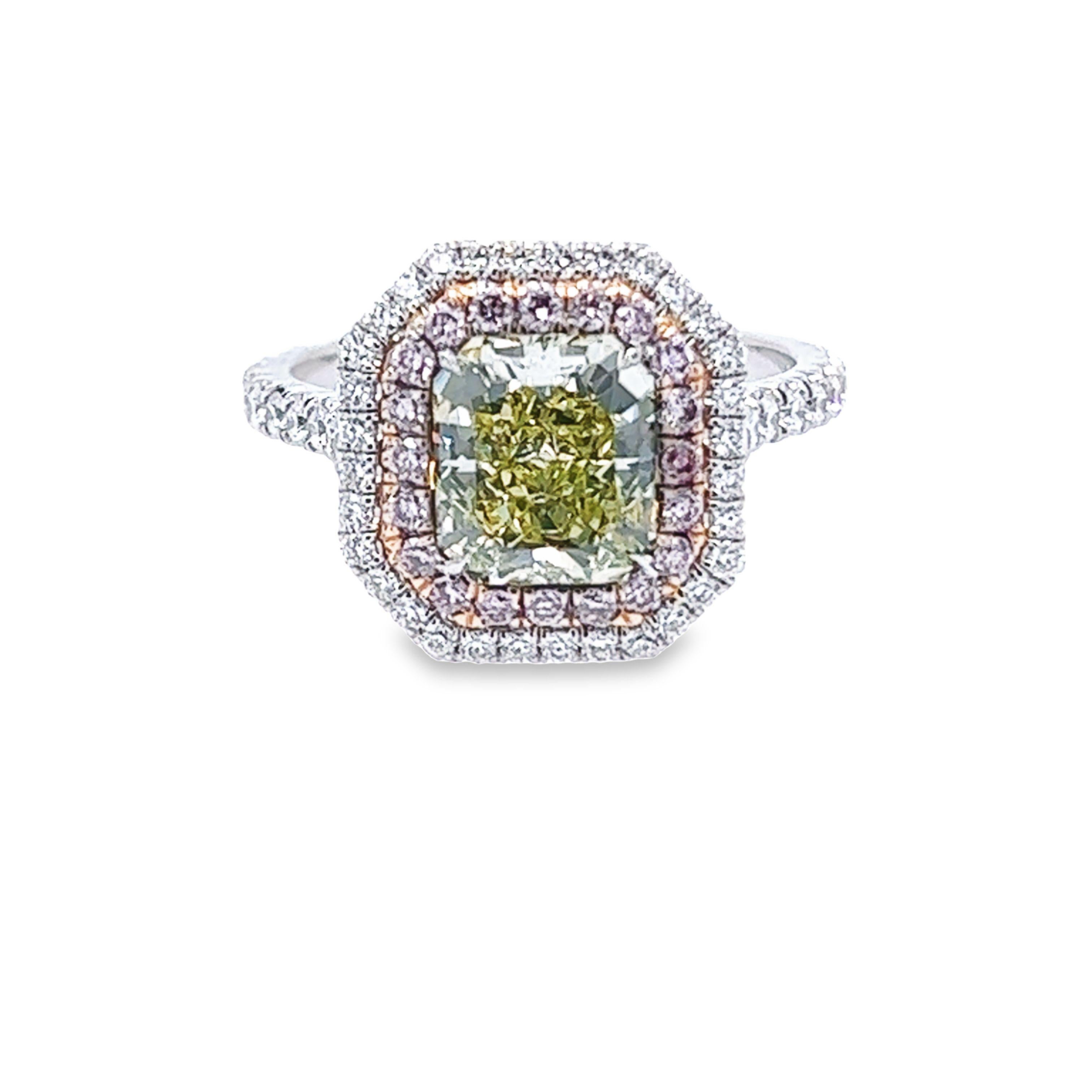 Rosenberg Diamonds & Co. 2.07 carat Radiant cut  Fancy Green Yellow VS1 clarity is accompanied by a GIA certificate. This beautiful Radiant is set in a handmade platinum setting and completes the look with a beautiful double halo of .80 carat total