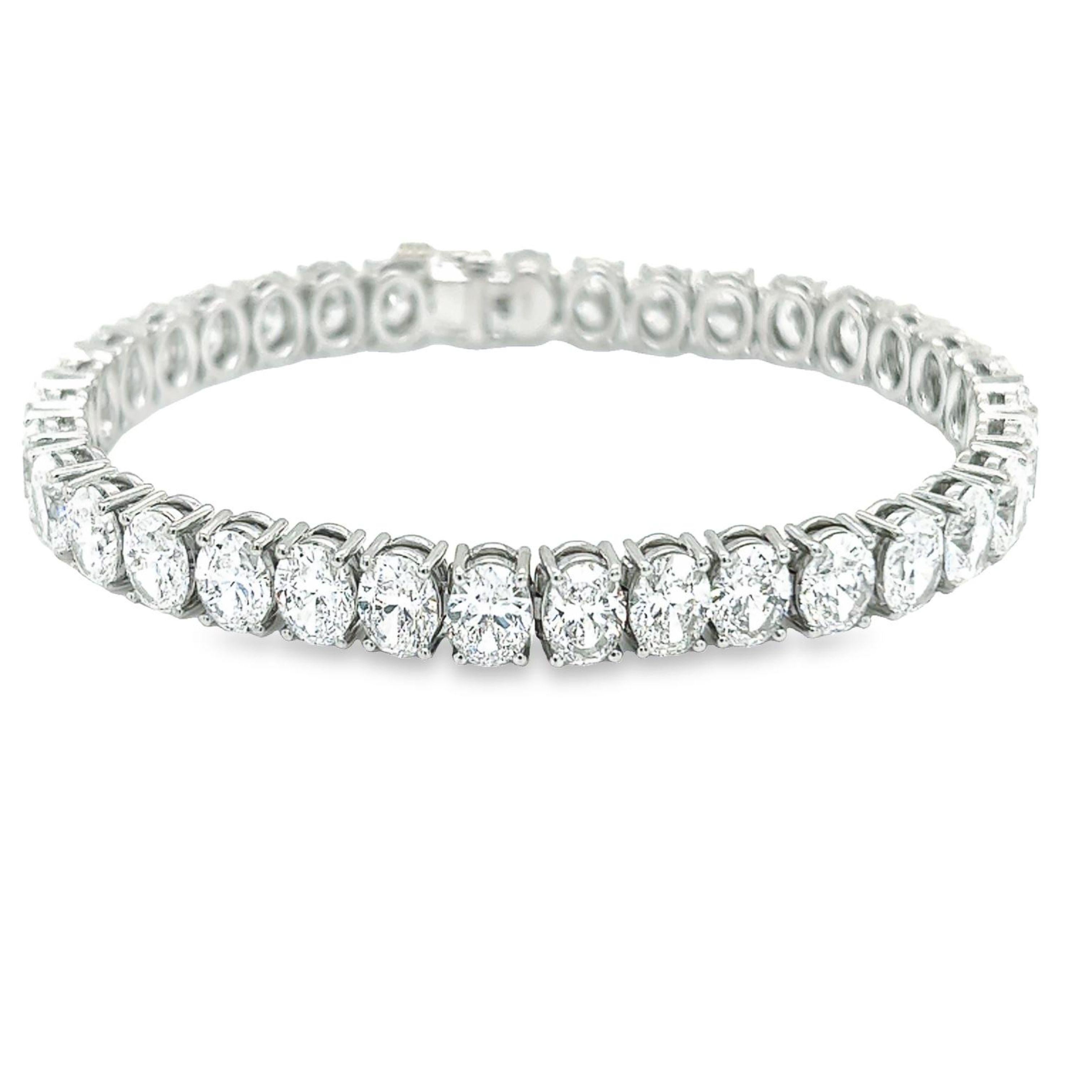Rosenberg Diamonds & Co. 24.68 carat total weight Oval cut 7 inch diamond tennis bracelet set in platinum. This beautiful straight line bracelet consists of .70 carats, D-F in color VS2-IF in clarity. Each 35 stones are perfectly matched, top makes,