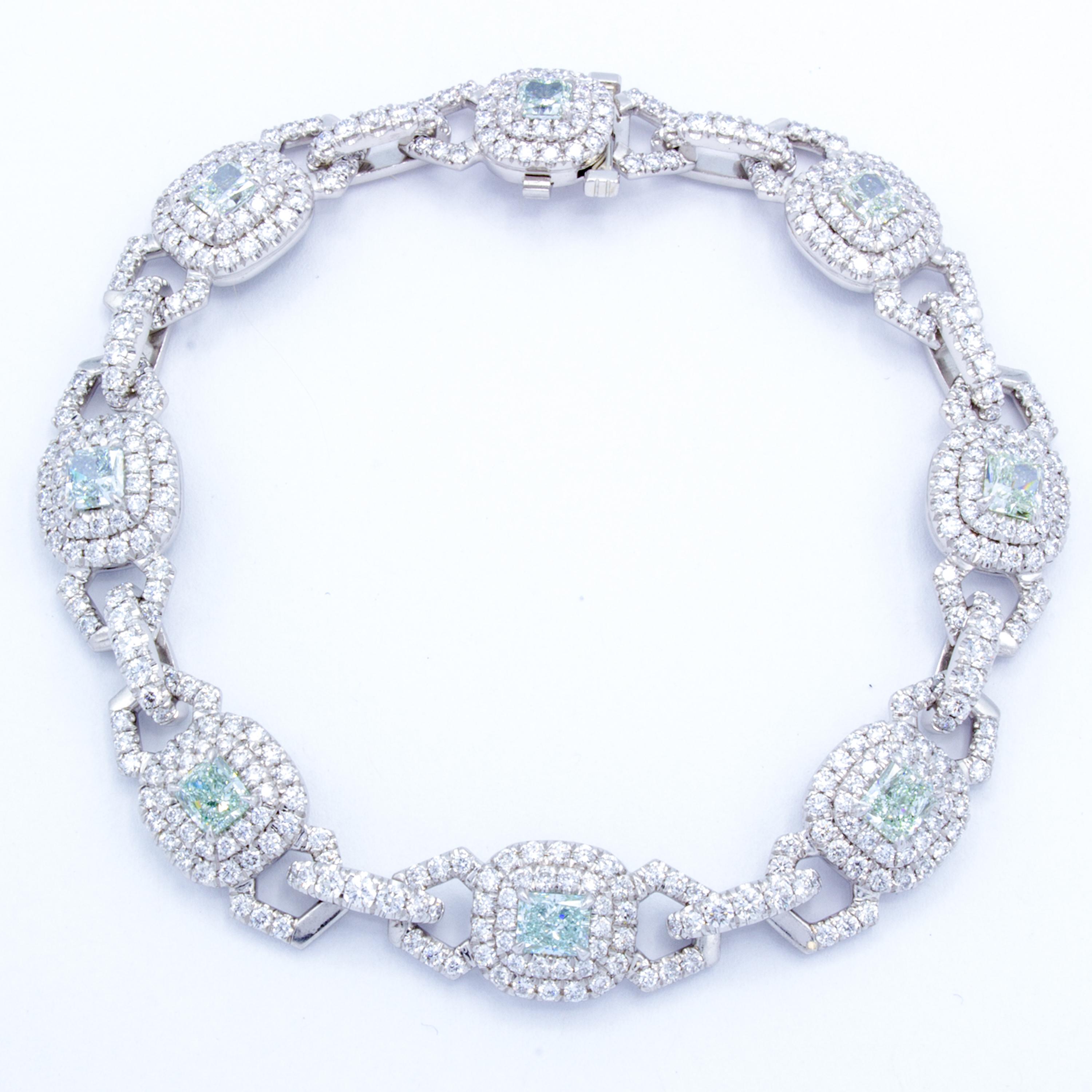 An elegant strand of glittering round brilliant pave set diamonds over a bracelet of pure platinum. A special collection of rare GIA certified radiant cut fancy light green diamonds rest connected by the double halo and linked design of yet another
