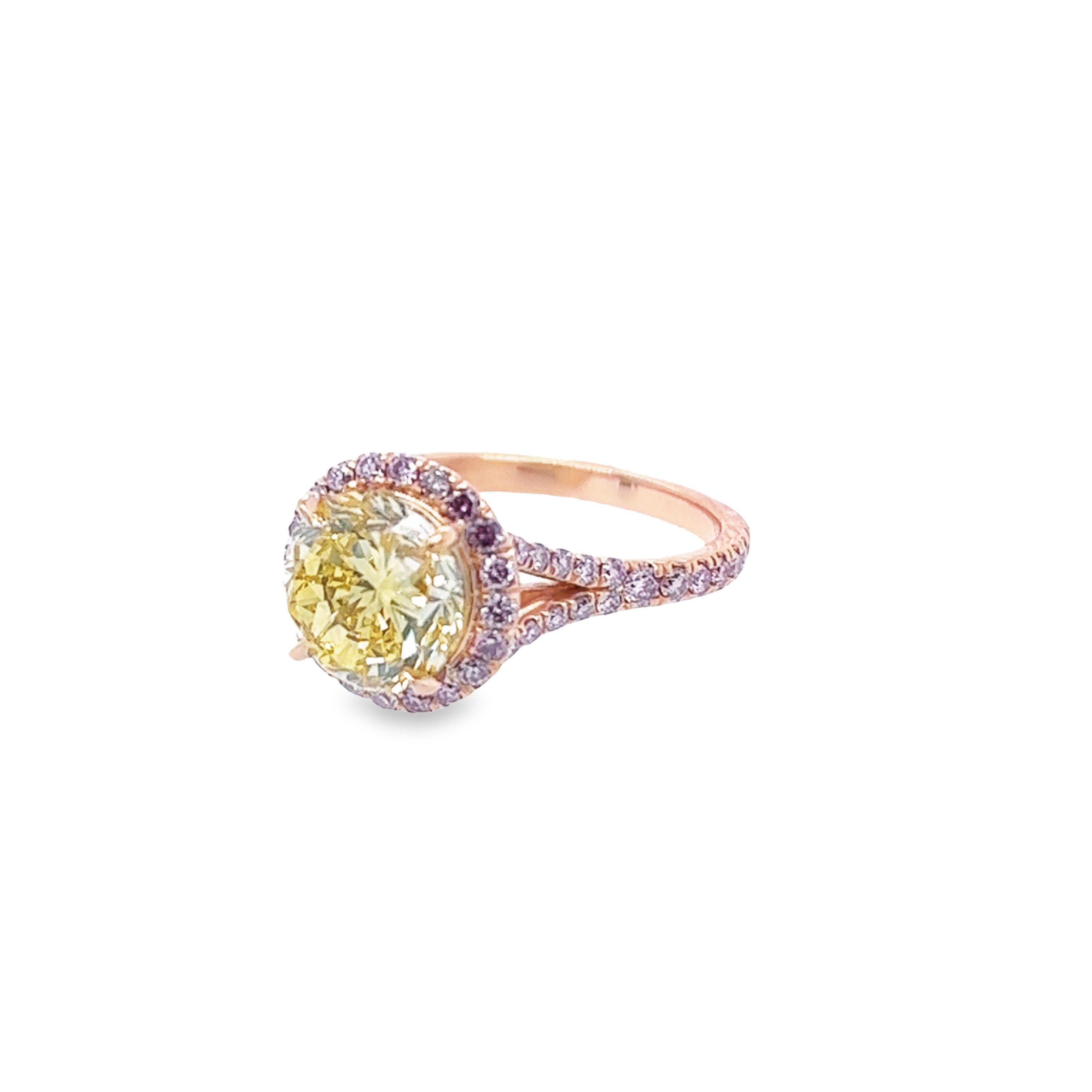 Rosenberg Diamonds & Co. 2.61 carat Round Brilliant Fancy Vivid Yellow Internally Flawless clarity is accompanied by a GIA certificate. This beautiful vibrant round diamond is set in a handmade 18k rose gold setting and completes the look with a