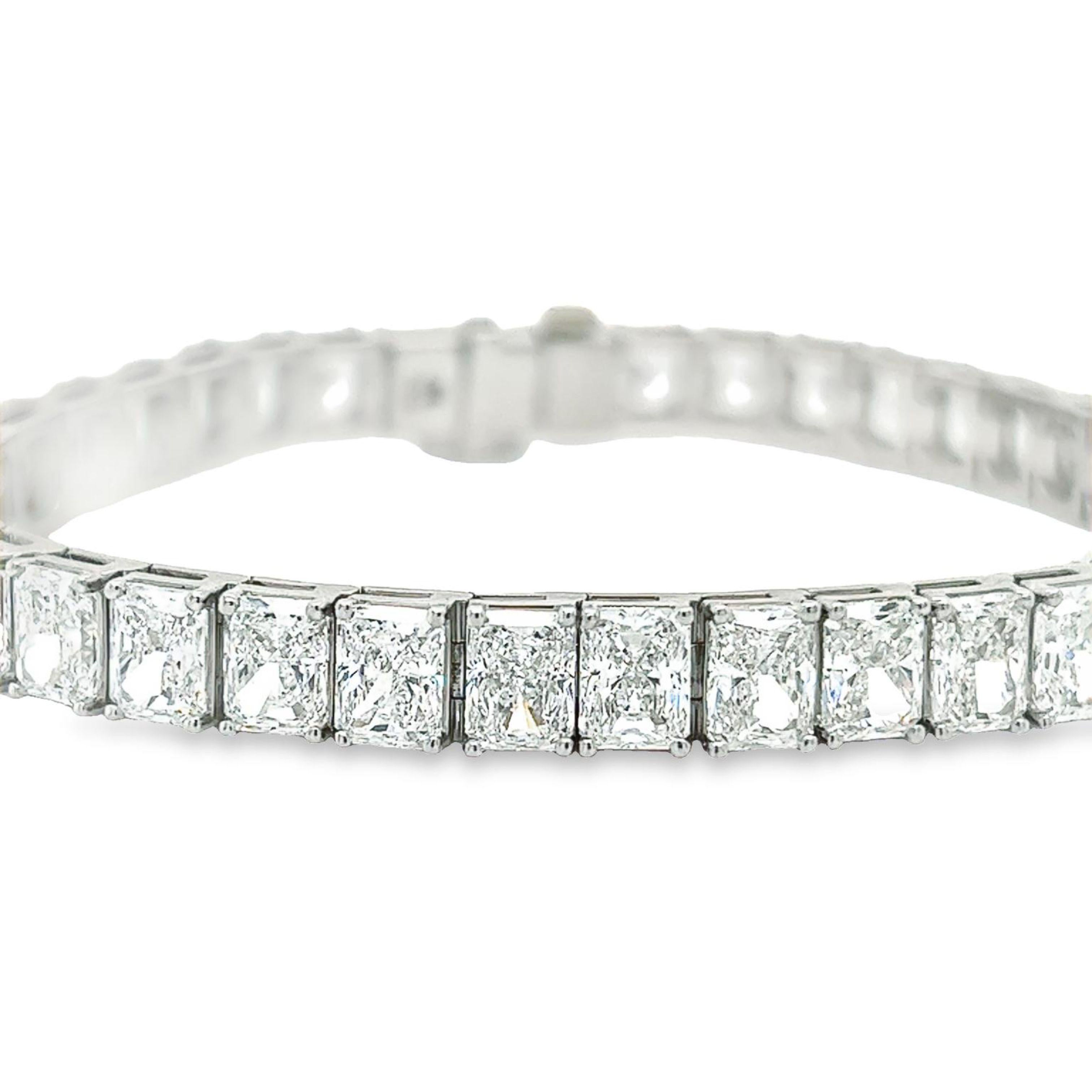 Rosenberg Diamonds & Co. 26.74 carat total weight Radiant shape 7 inch diamond tennis bracelet set in platinum. This beautiful straight line bracelet consists of .70 carats, D-G in color VVS1-VS2 in clarity. Each 38 stones are perfectly matched, top