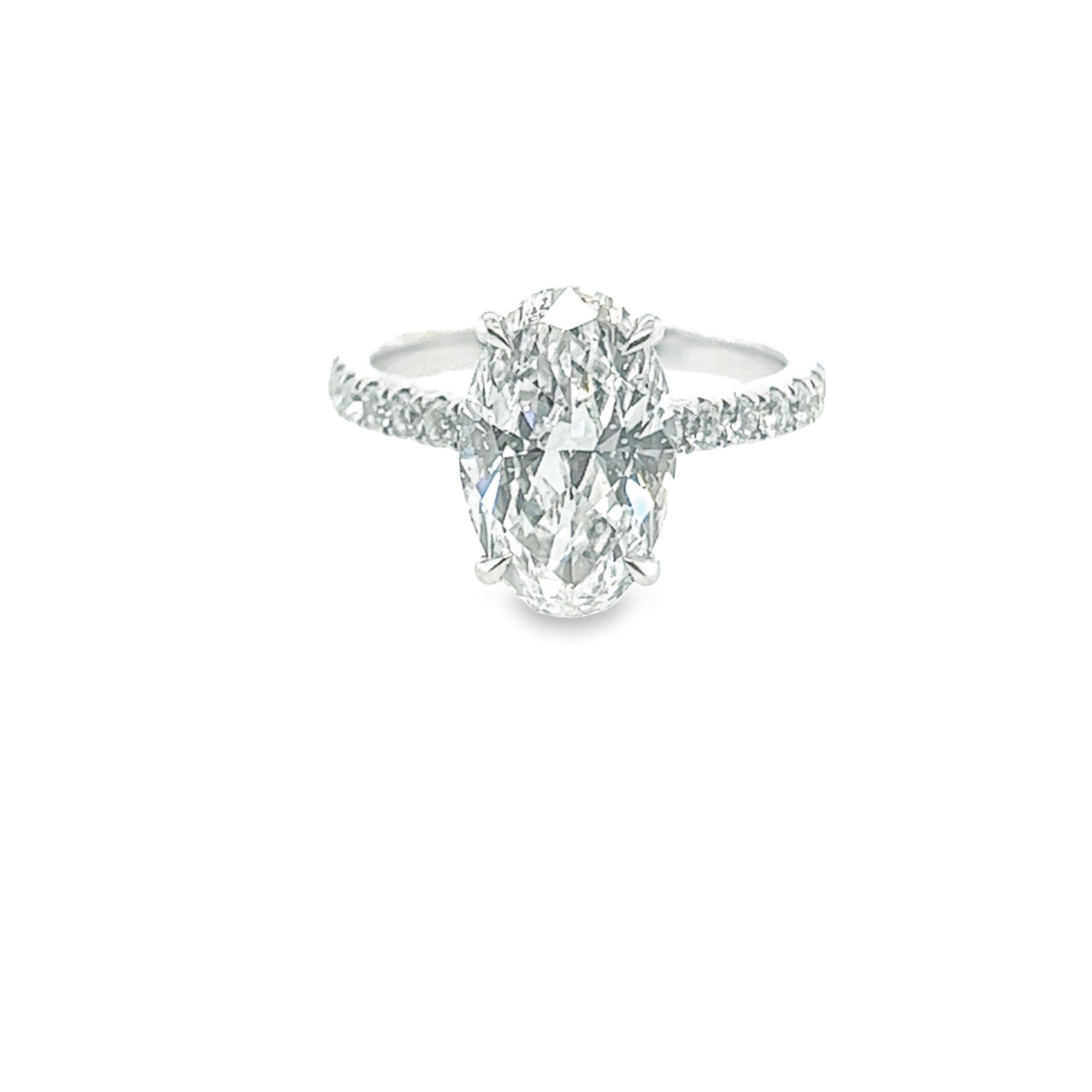 Rosenberg Diamonds & Co. 3.19 carat Oval cut D color SI2 clarity is accompanied by a GIA certificate. This breathtaking Oval is full of brilliance and an exceptional SI2 that is set in a handmade 18 karat white gold setting. This ring continues its